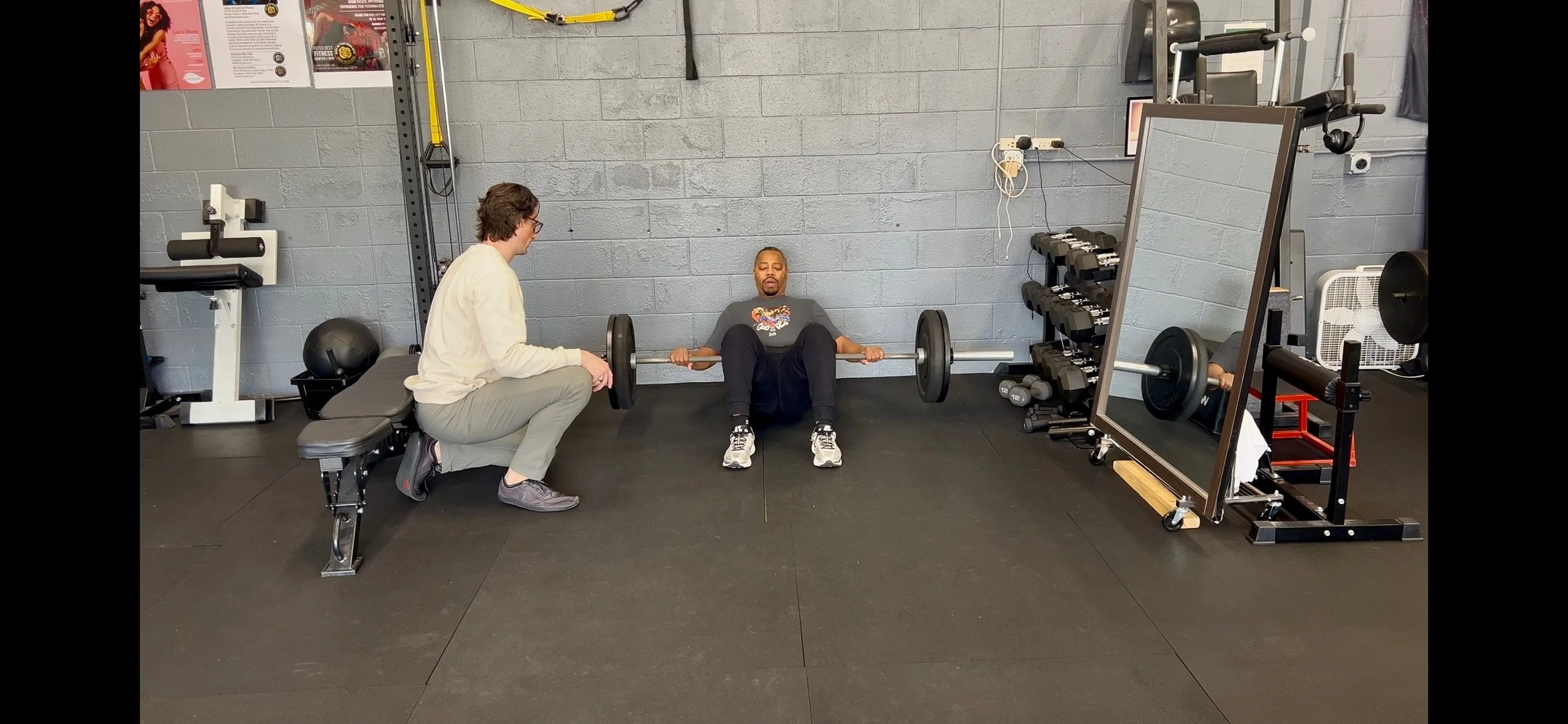 Dr. Ryan Eckert using a hip thrust to help a patients knee pain.