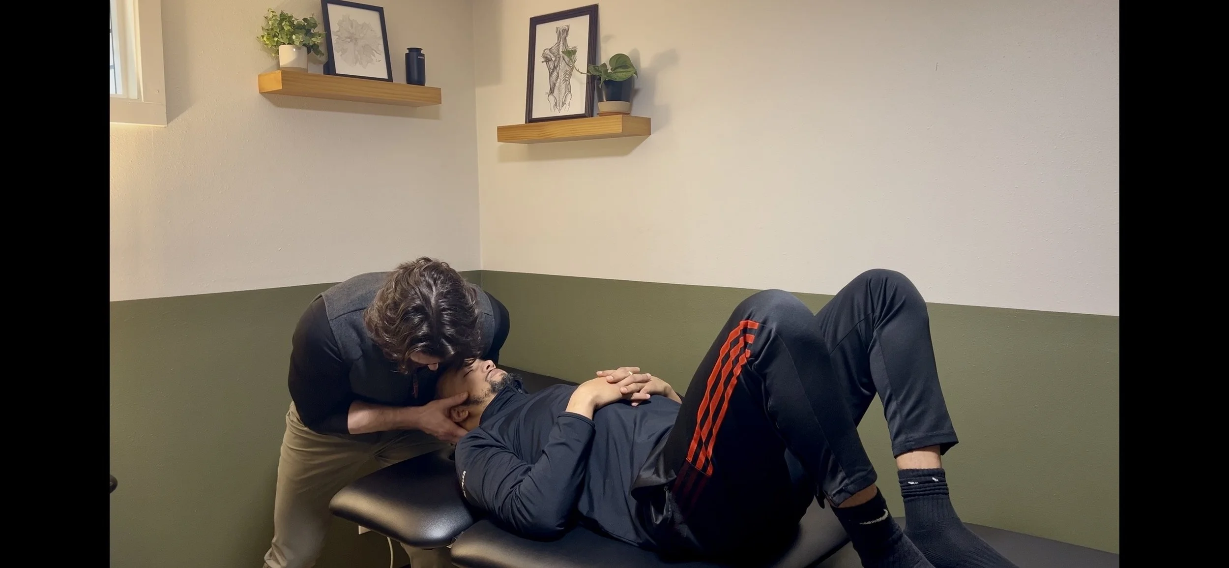 Dr. Ryan Eckert performing traction with overpressure into retraction to help headaches.