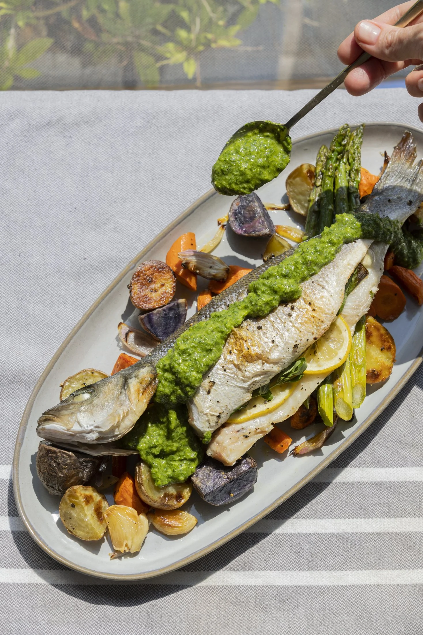 whole fish plating green sauce.jpg
