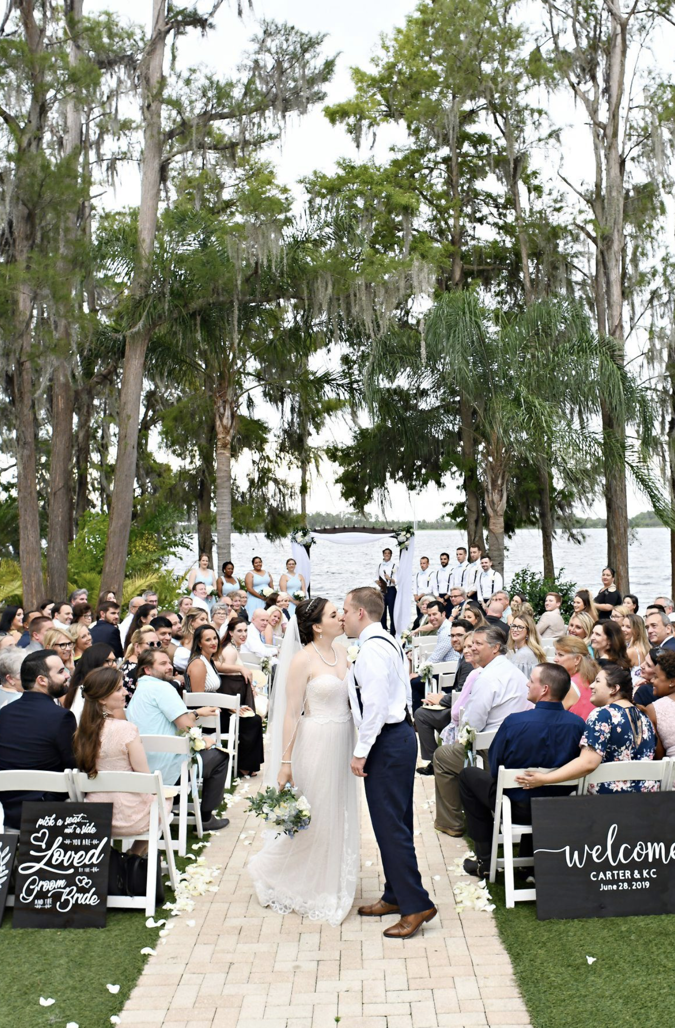 paradise cove orlando wedding bride and groom kissing wedding dress and tux