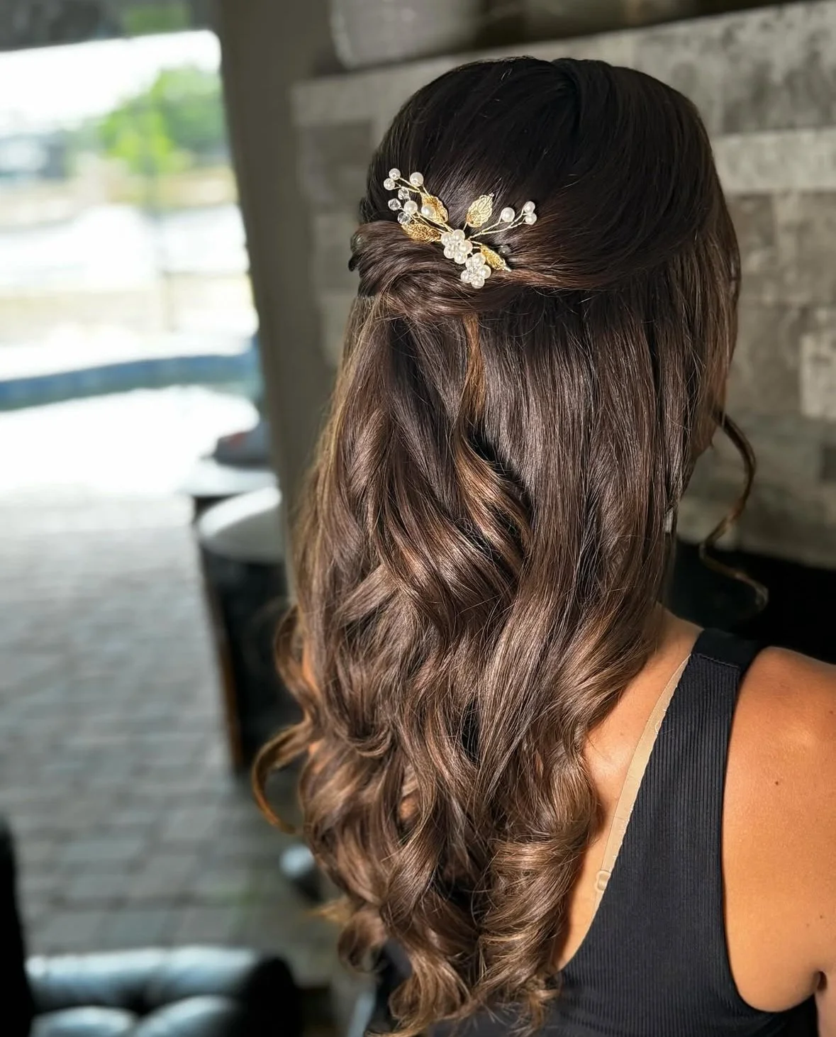 Half up half down style for any event or wedding female with brown hair and hair piece