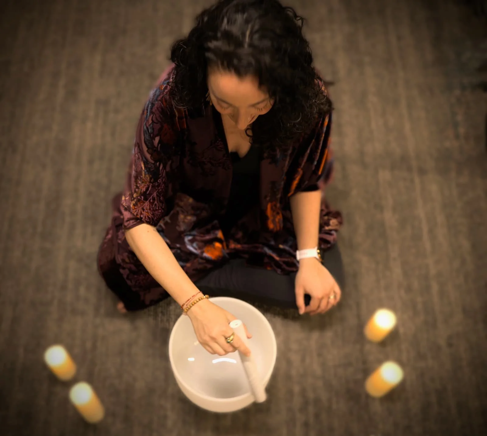 Woman playing singing bowls in Connecticut
