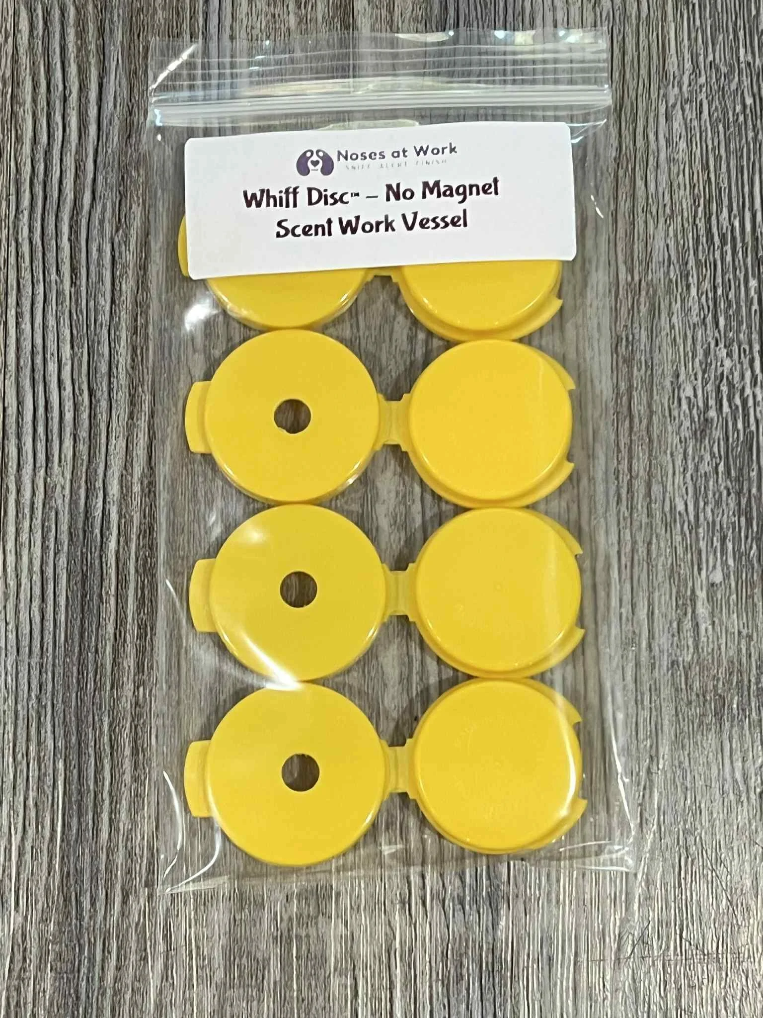 Compact hinged odor container disc for scent work and nose work hides, easy to place with glue dots or putty