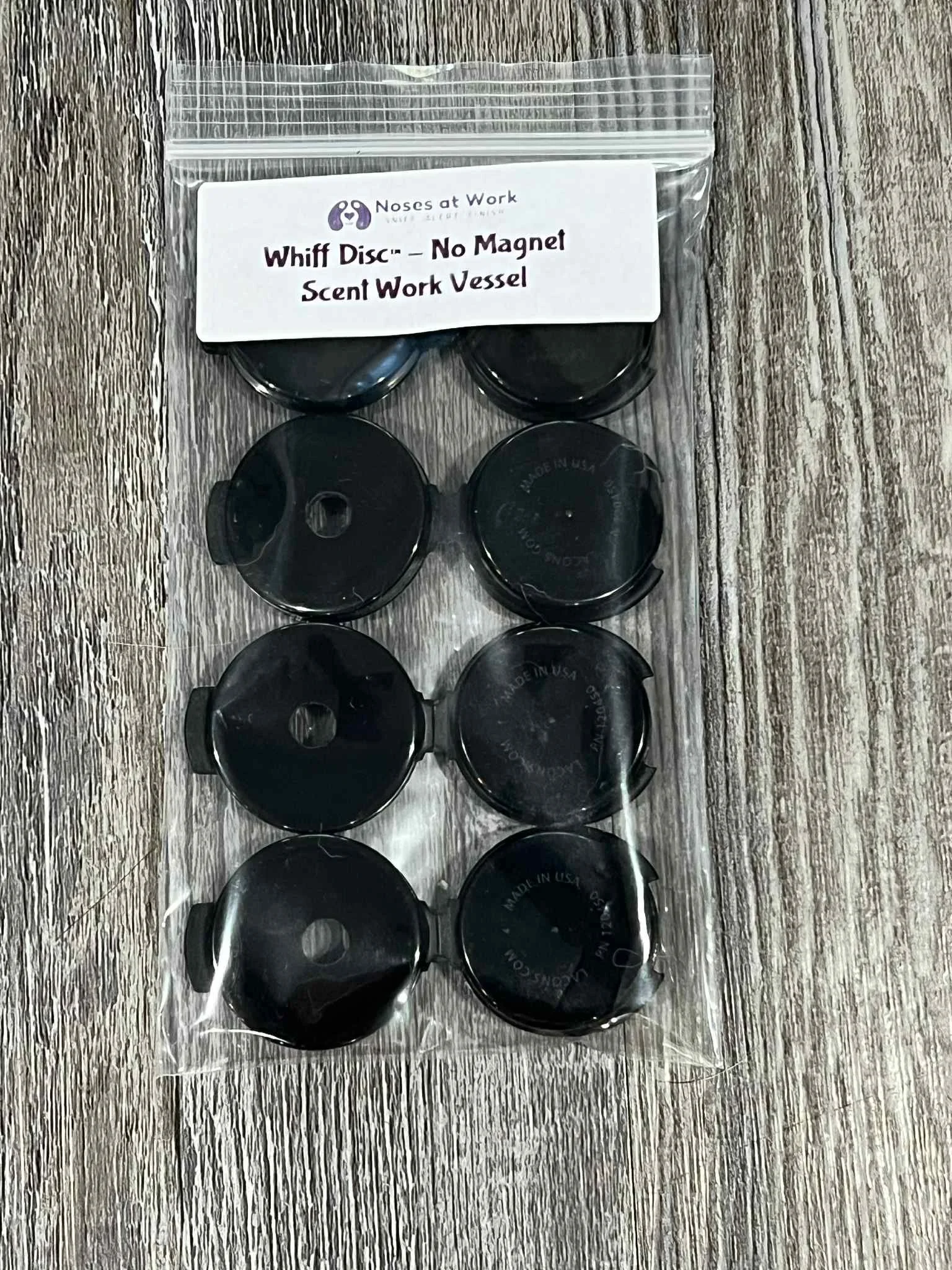 Small low-profile scent work vessel for hidden odor searches, hinged disc design for discreet placement