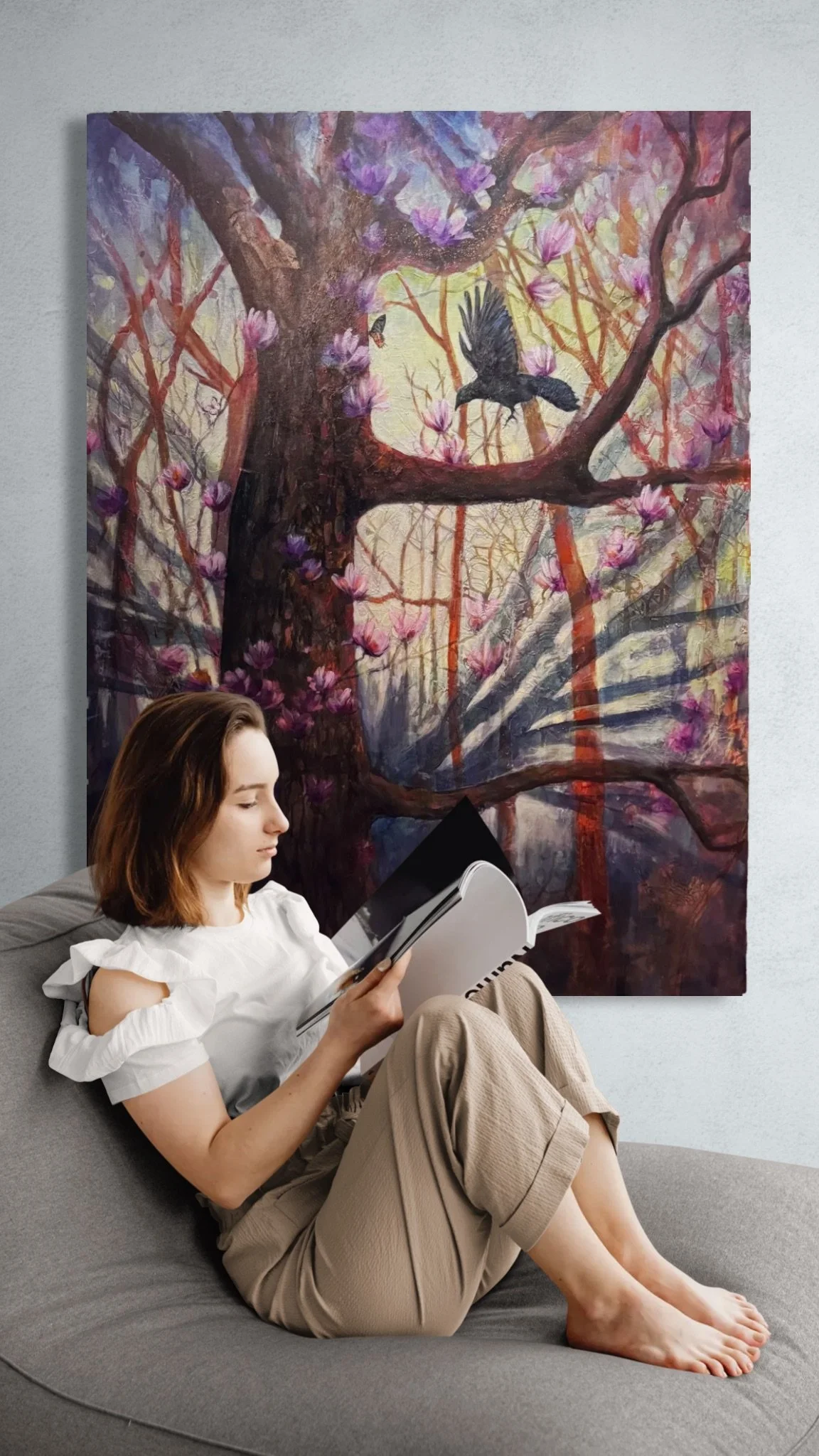 Girl reading a book next to a wall.jpeg