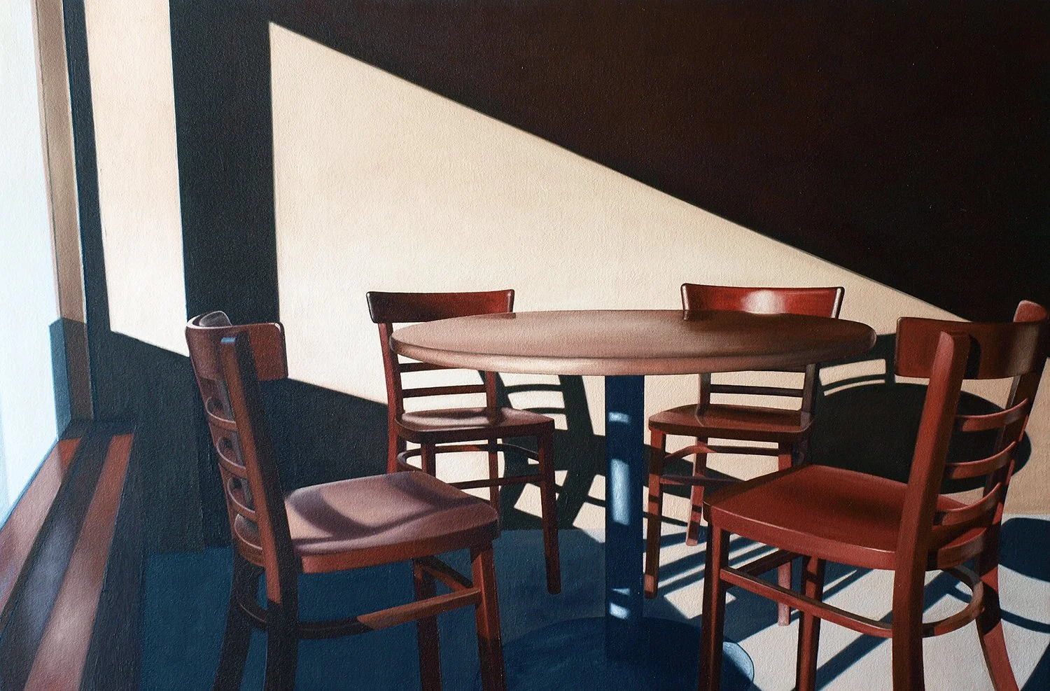 chairs and table under intense shadow