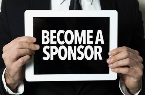 Person holding a sign that says 'Become a Sponsor'