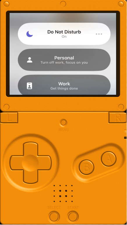 A handheld electronic device with a small screen displaying options for 'Do Not Disturb', 'Personal', and 'Work'. The device has an orange body, a directional pad, and buttons labeled A, B, and R.