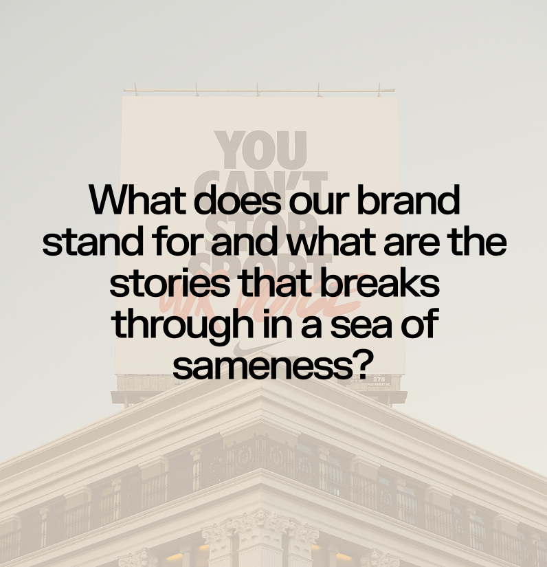 A building with a large billboard on top that reads 'YOU CAN'T STOP US' in the background. Overlaid on the image is a quote, 'What does our brand stand for and what are the stories that break through in a sea of sameness?'