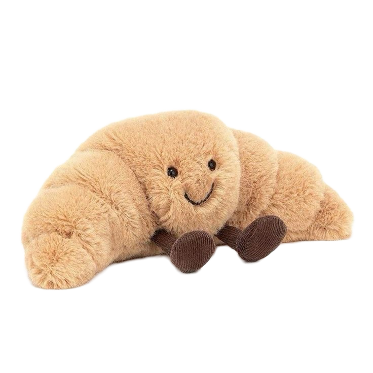 A plush toy in the shape of a smiling crab with tan body and brown claws and eyes.