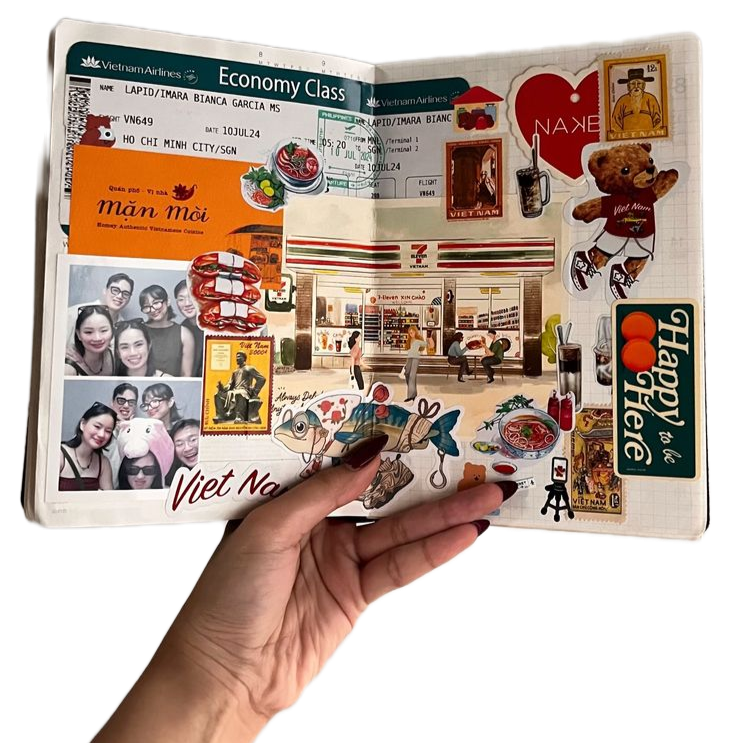 A travel scrapbook with collage-style stickers of Vietnamese symbols, food, and scenes, including airplane tickets, a photo of smiling friends wearing animal hats, and various illustrated souvenirs and landmarks.
