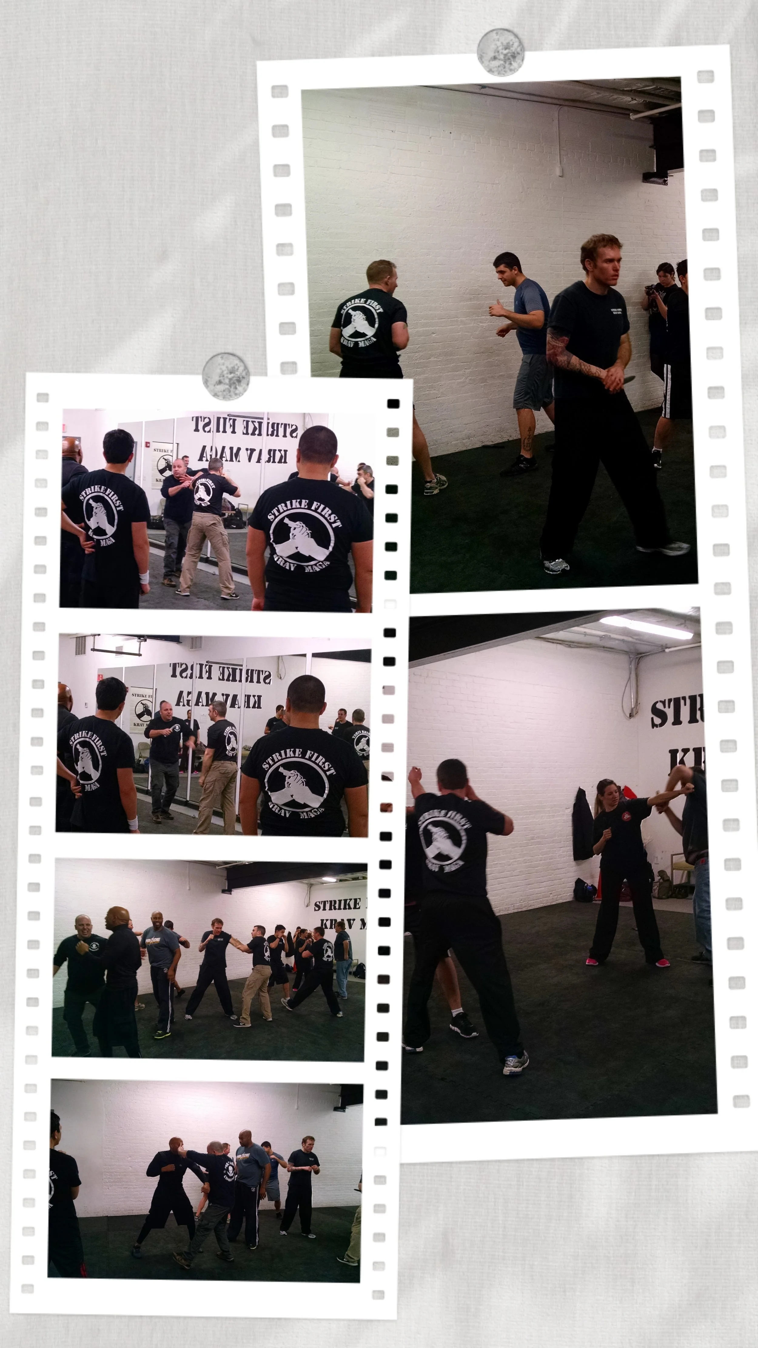 Group of people practicing martial arts in a training room with white brick walls, some wearing black shirts with a circular logo that says 'Strike First' with a fist.