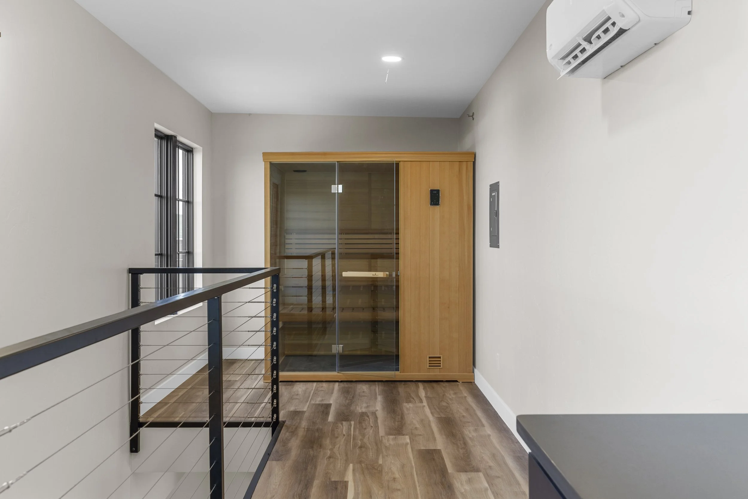 Private sauna inside an Ice Haus Condo for sale in Sheridan, Wyoming, offering a luxury wellness feature in a modern condo layout.