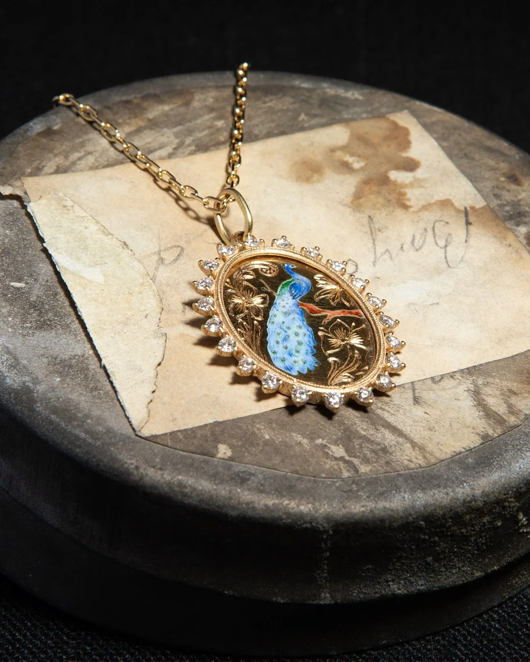 Hand engraved, painted and enameled - this 18k yellow gold Peacock Pendant surrounded with .63ctw of spaced white diamonds by @ericamolinarijewelry is such a beautiful, timeless piece. &lsquo;Ogni momento &egrave; un novo inizio&rsquo; which translat