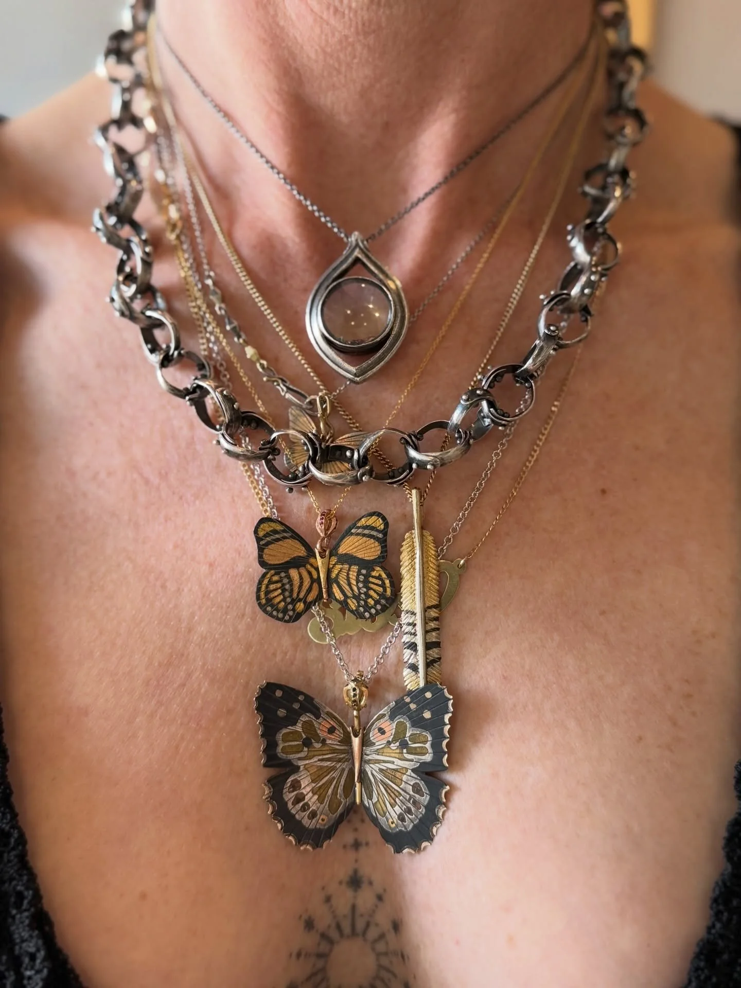 Layers of hand made beautiful pieces by amazing designers - Heavy Silver Chain @tenthousandthingsnyc Butterflies, feather, &amp; monocle @jamesbanksdesign *most are available @aheutsche #onallison #studiocity #losangeles