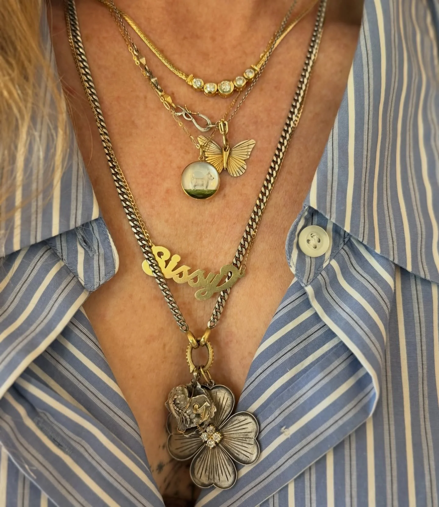 When worlds collide and jewelry tells a story. #onallison top to bottom - New #vintage diamond necklace, The Chocolate Albatross butterfly, #vintage Essex crystal pendant, Sissy name plate, Large silver clover charm and a sacred heart from my mom. So