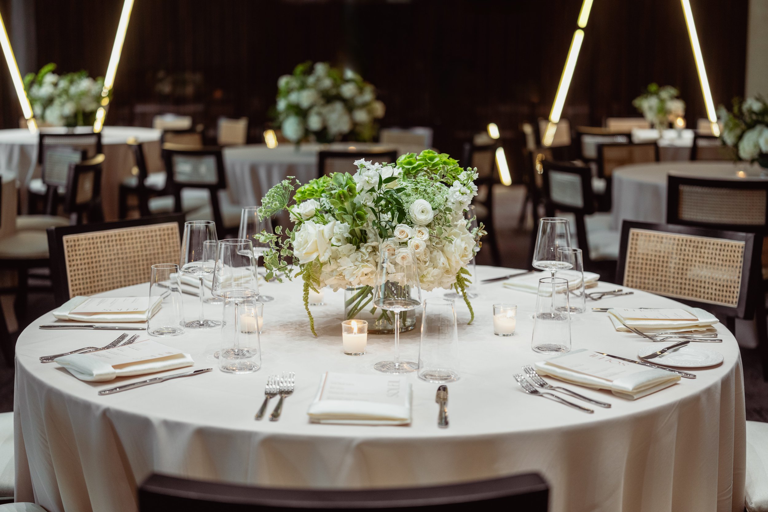 round table with florals and candles