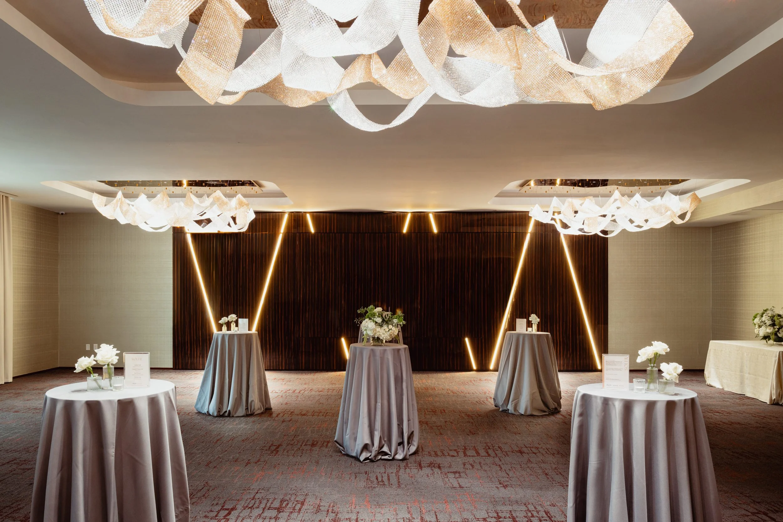 Five cocktail tables with florals