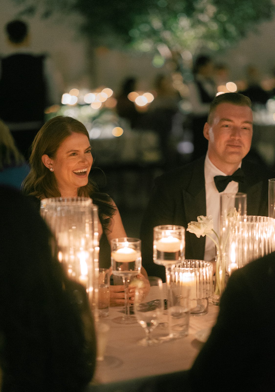 guests at table with candles