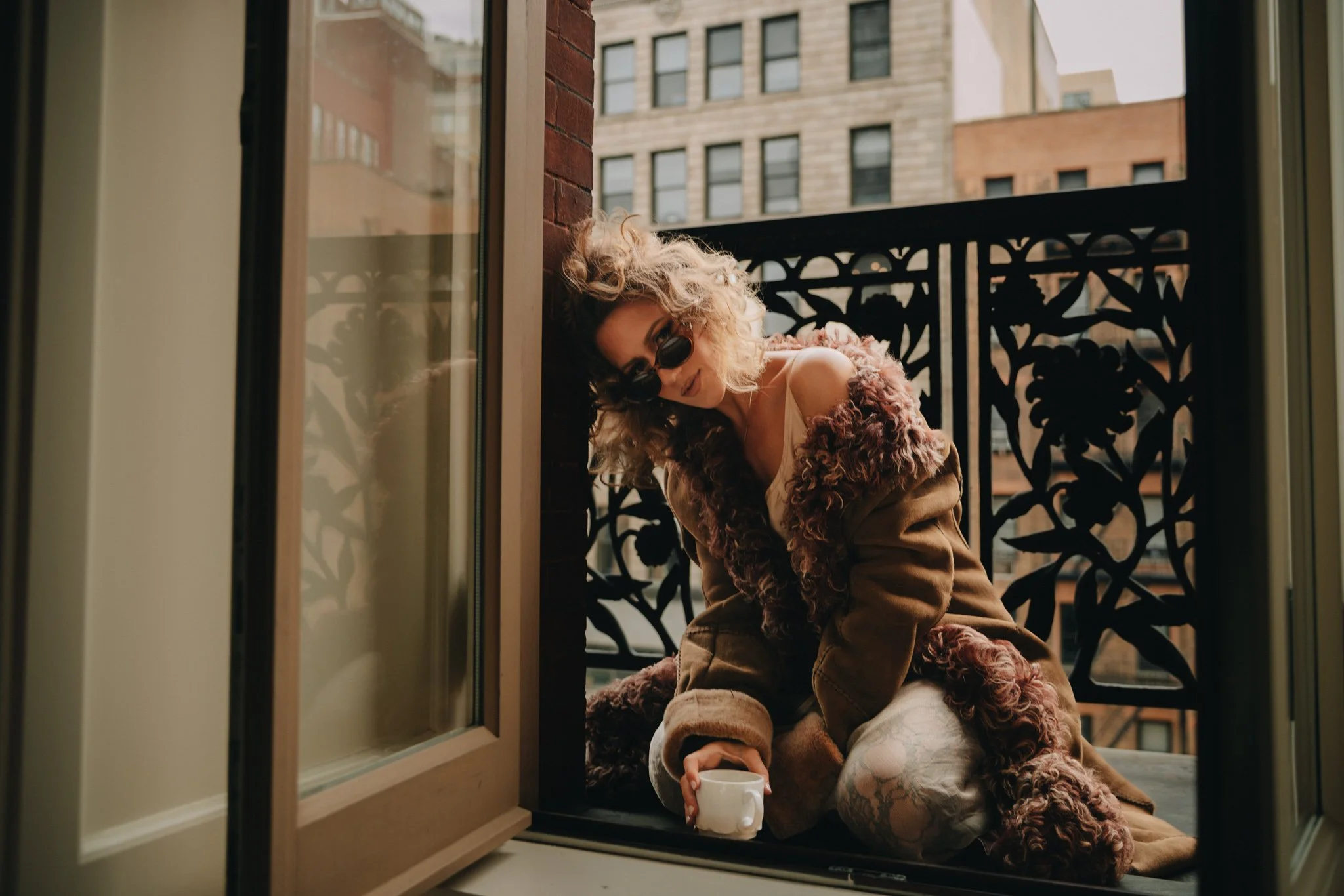 Jessica, balcony, coffee looking at camers.jpg