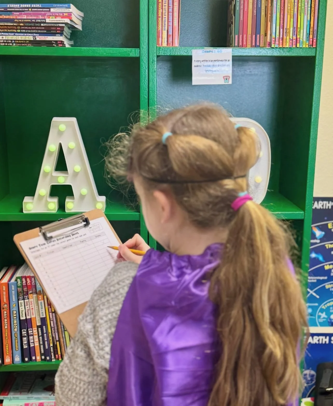 A student writing at Carpe Diem