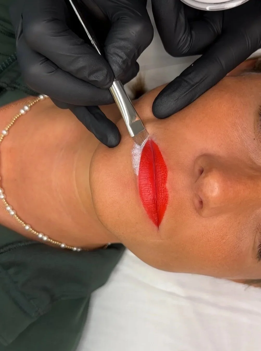Lip Blushing procedure performed at TéTé in Conway, South Carolina, with pigment being applied to the lips.