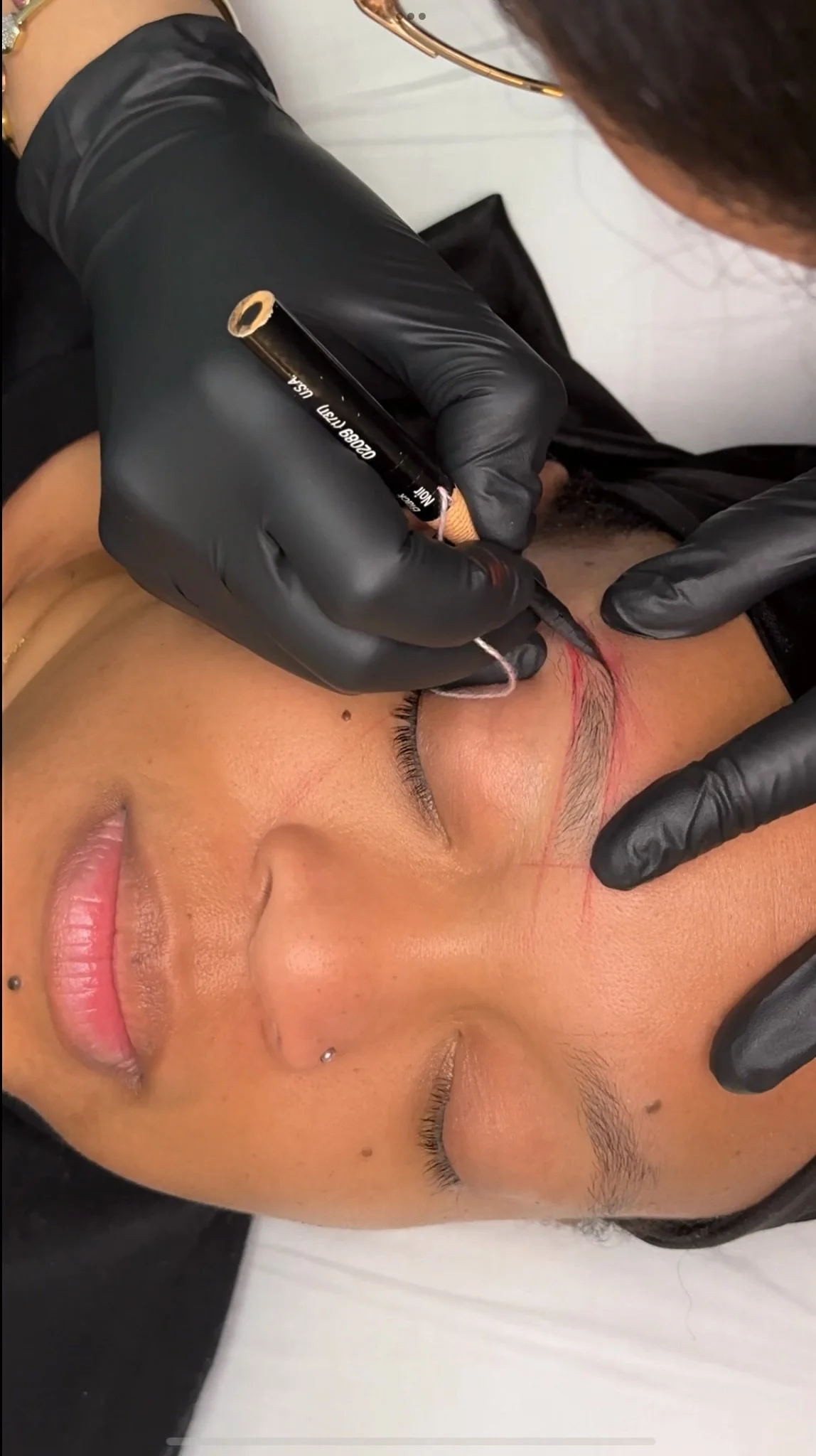 Permanent makeup brow procedure at TéTé in Conway, SC, creating Combo Brow with a tattoo machine.
