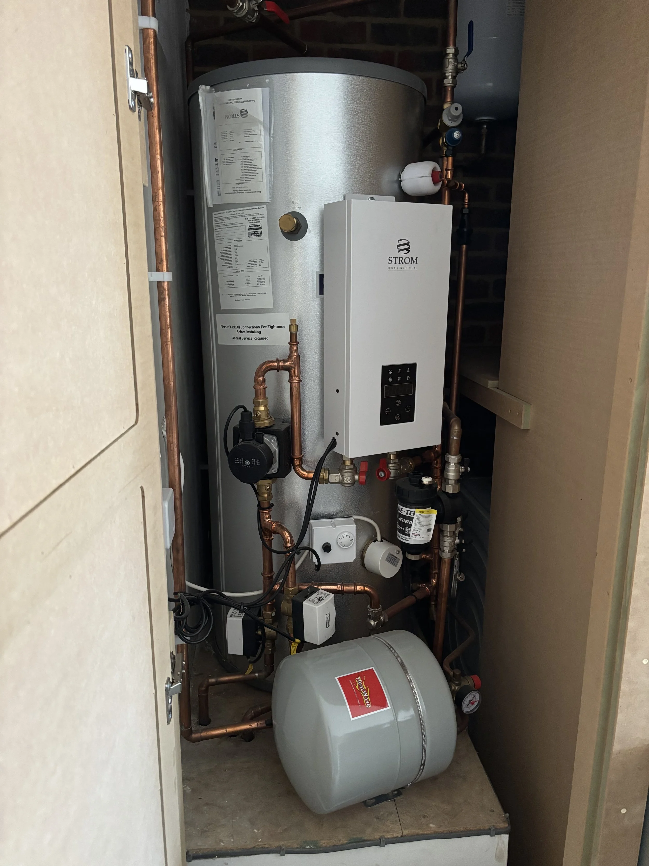 Electric boiler in cupboard