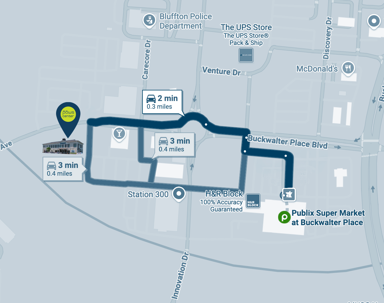Map of Buckwalter Place Blvd showing nearby landmarks, including Publix Super Market, H&R Block, Station 300, Bluffton Police Department, and the UPS Store. The map indicates driving times between locations, ranging from two to three minutes, and shows streets and points of interest surrounding the area.