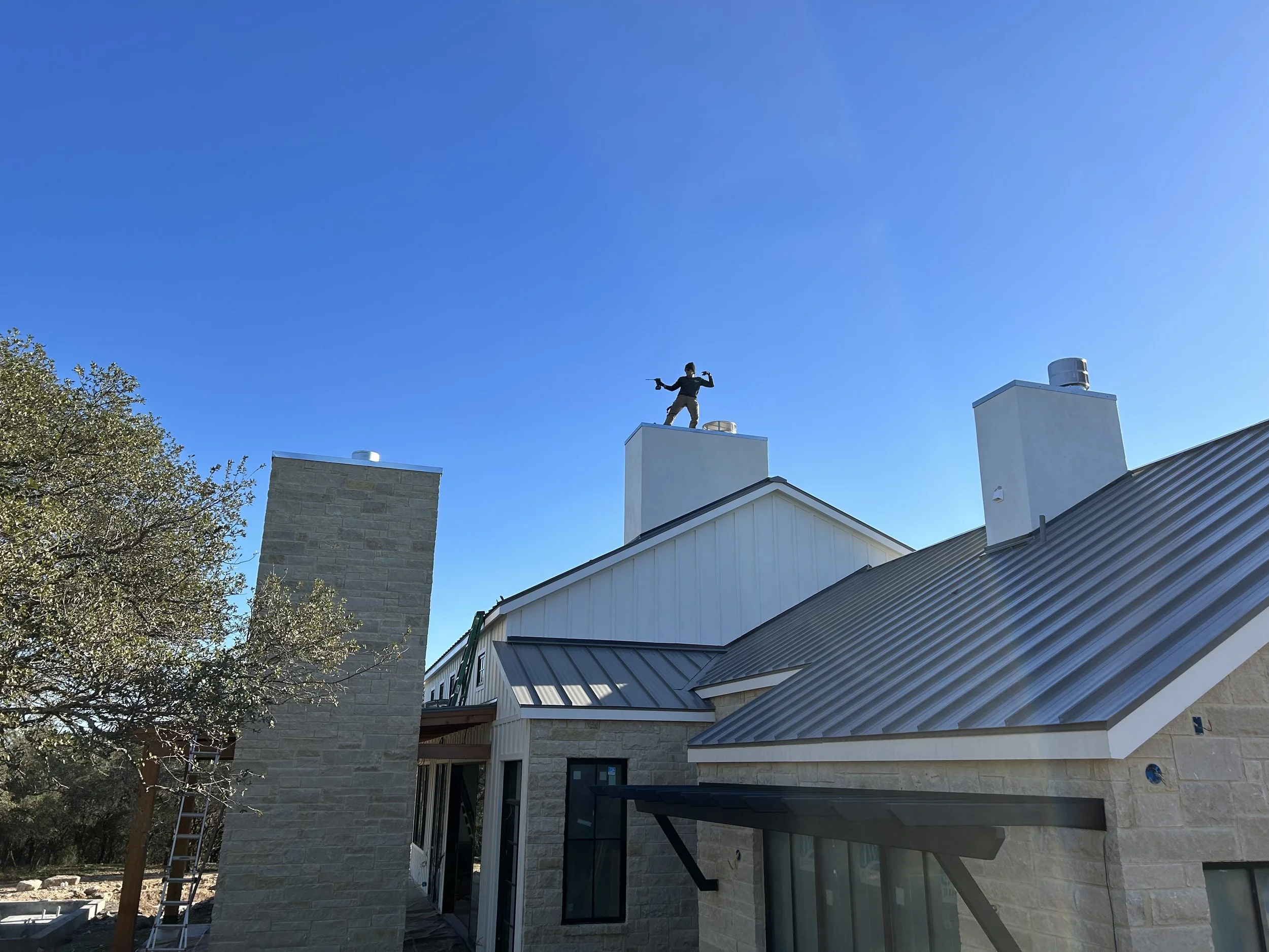 Oranssi technician working on a roof project