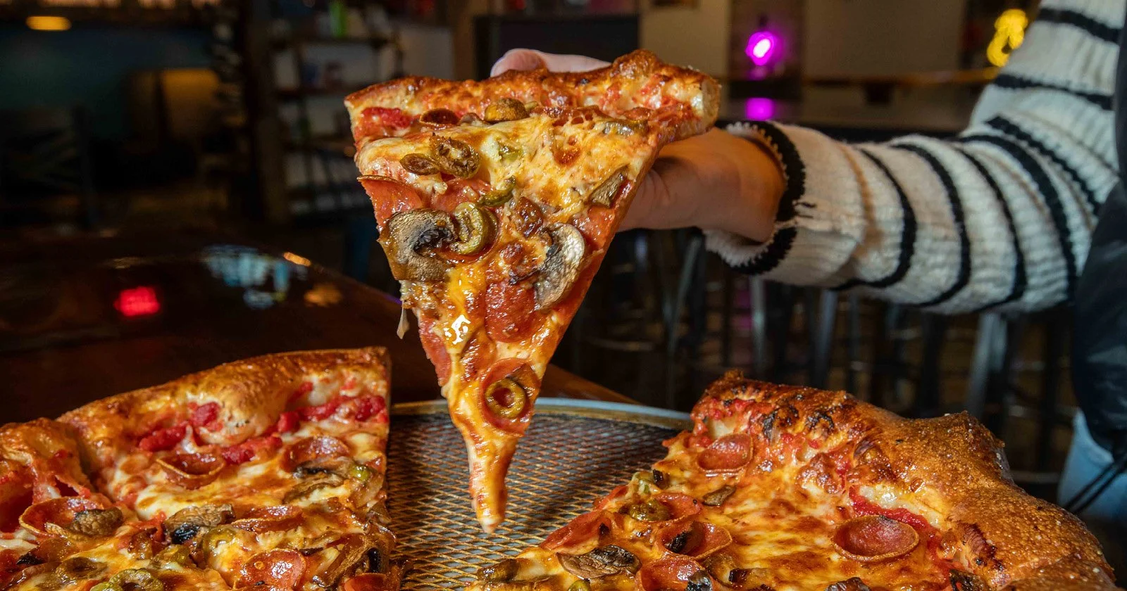 Slice of supreme pizza