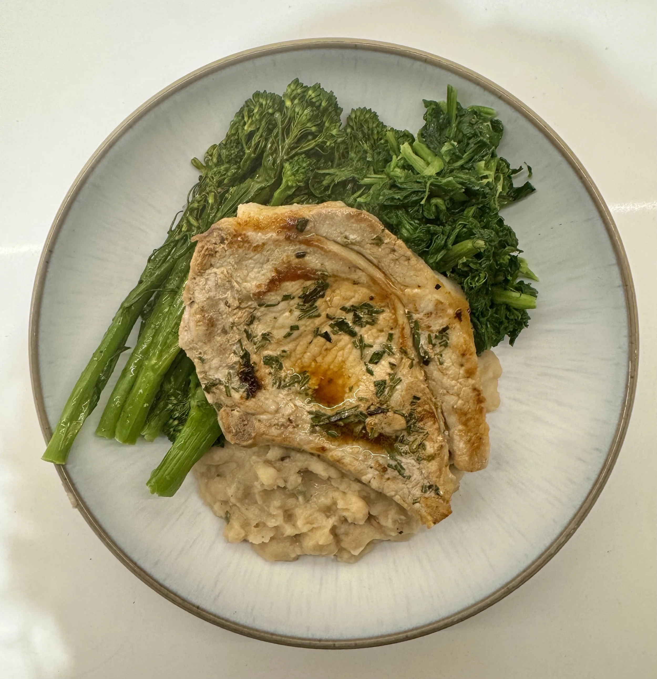 Recipe: Rosemary pork with white beans and garlic vegetables
