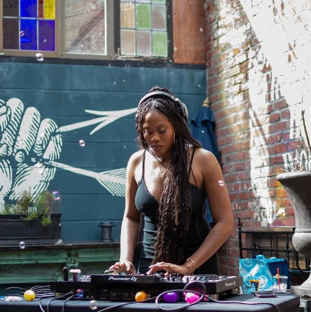Live DJ performing on a mixing turntable near Northern Liberties
