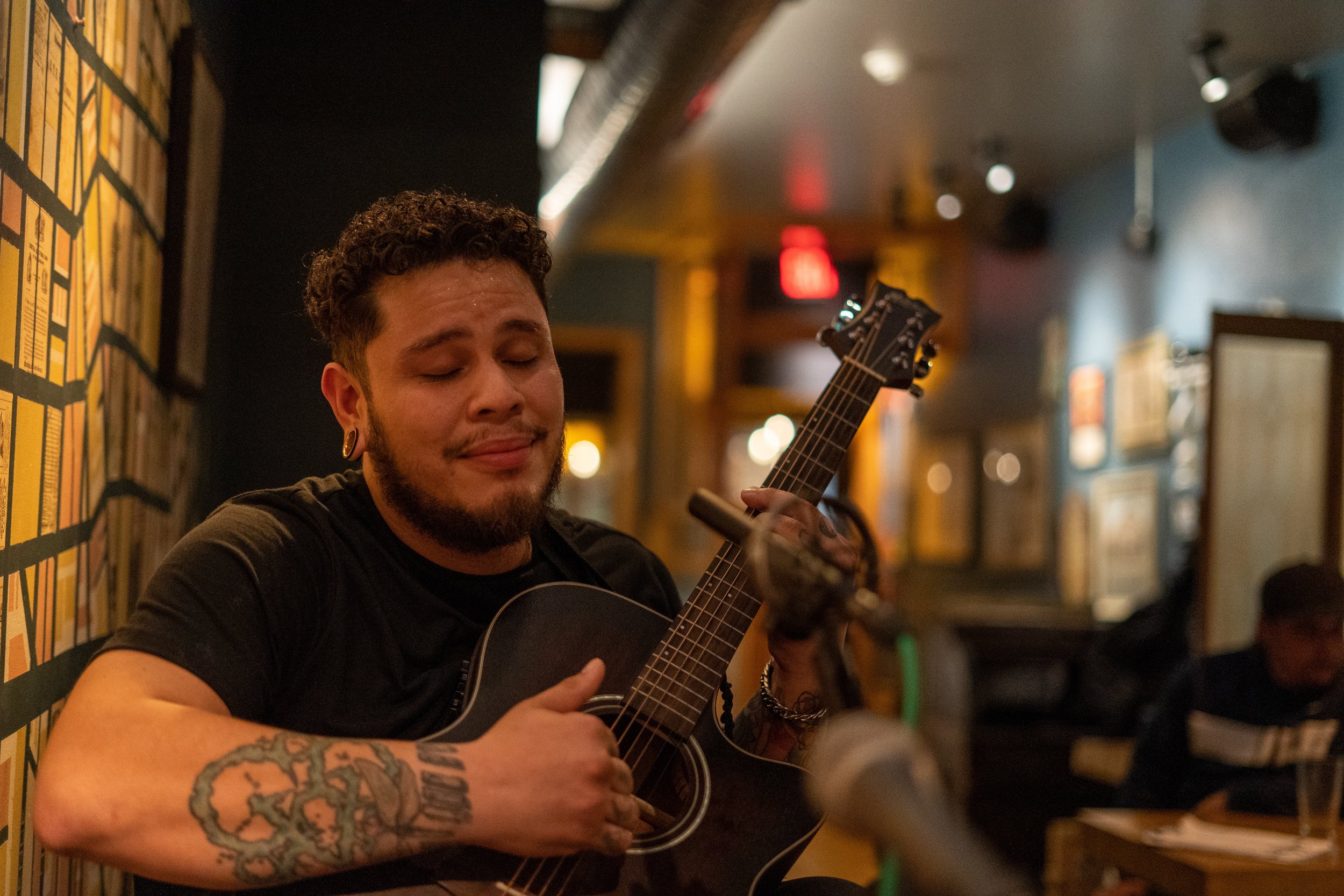 Artist playing live acoustic music in Fishtown
