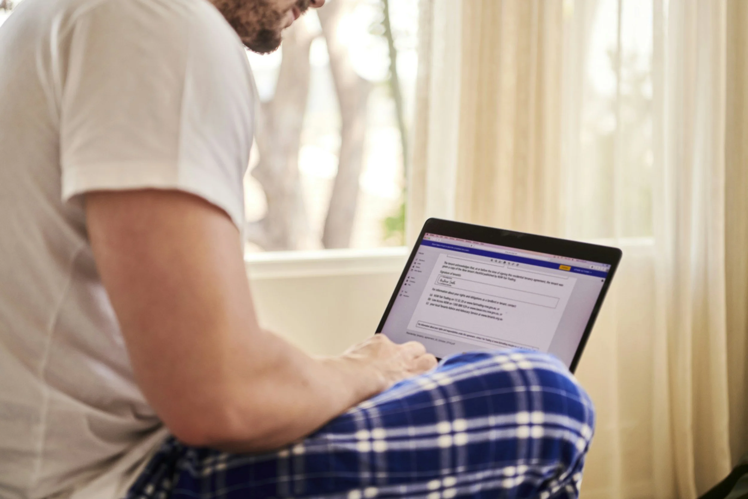 laptop on man's lap