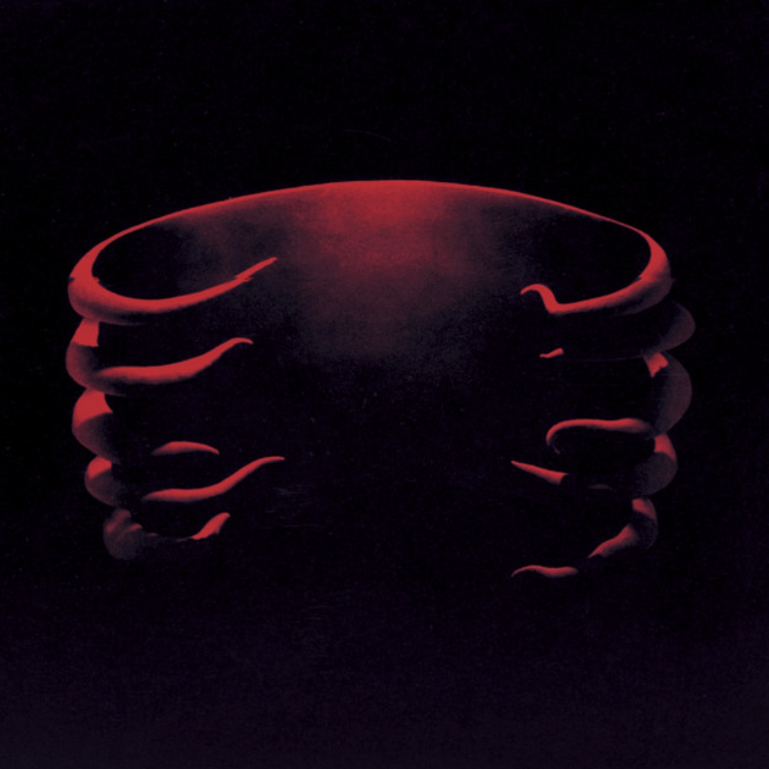 A glowing red, stylized crab with an illuminated outline on a dark background.
