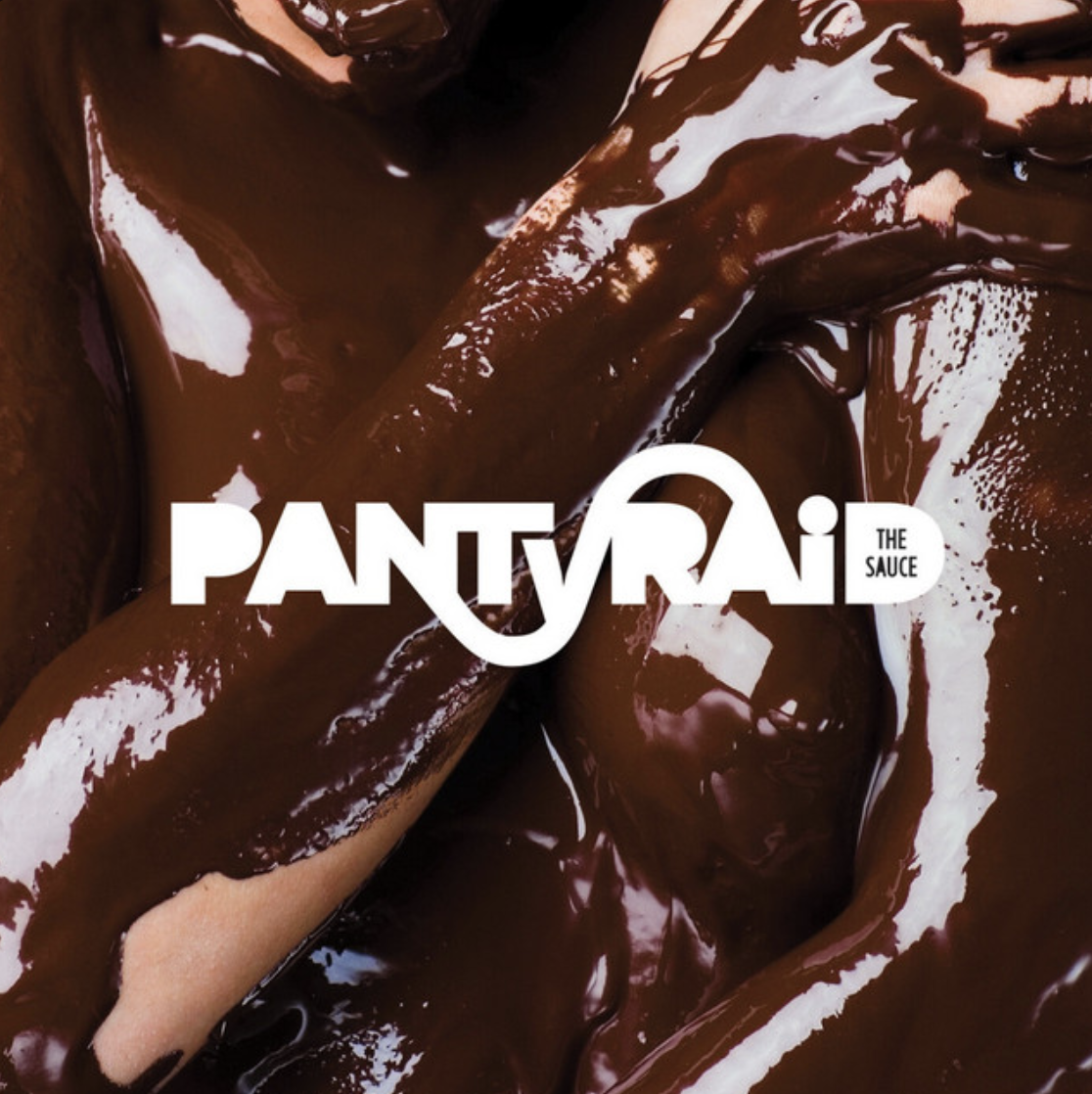 Close-up of melted chocolate with the text 'Pantra The Sauce' over it.