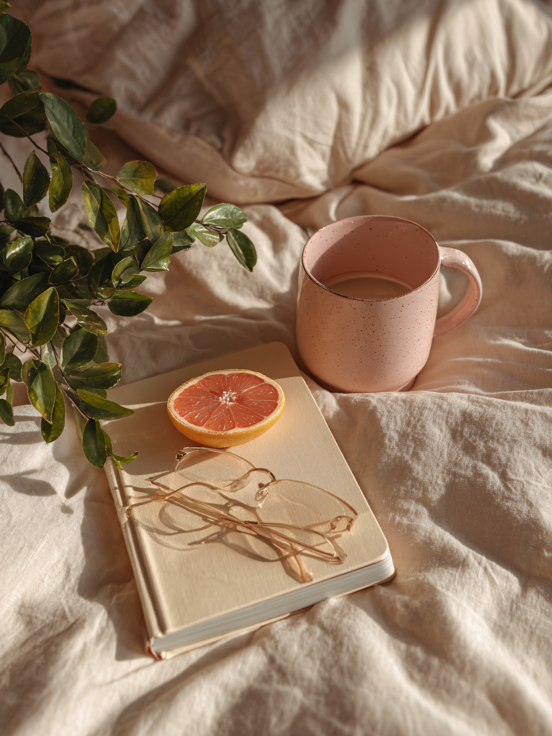 journal and tea on a cozy bed