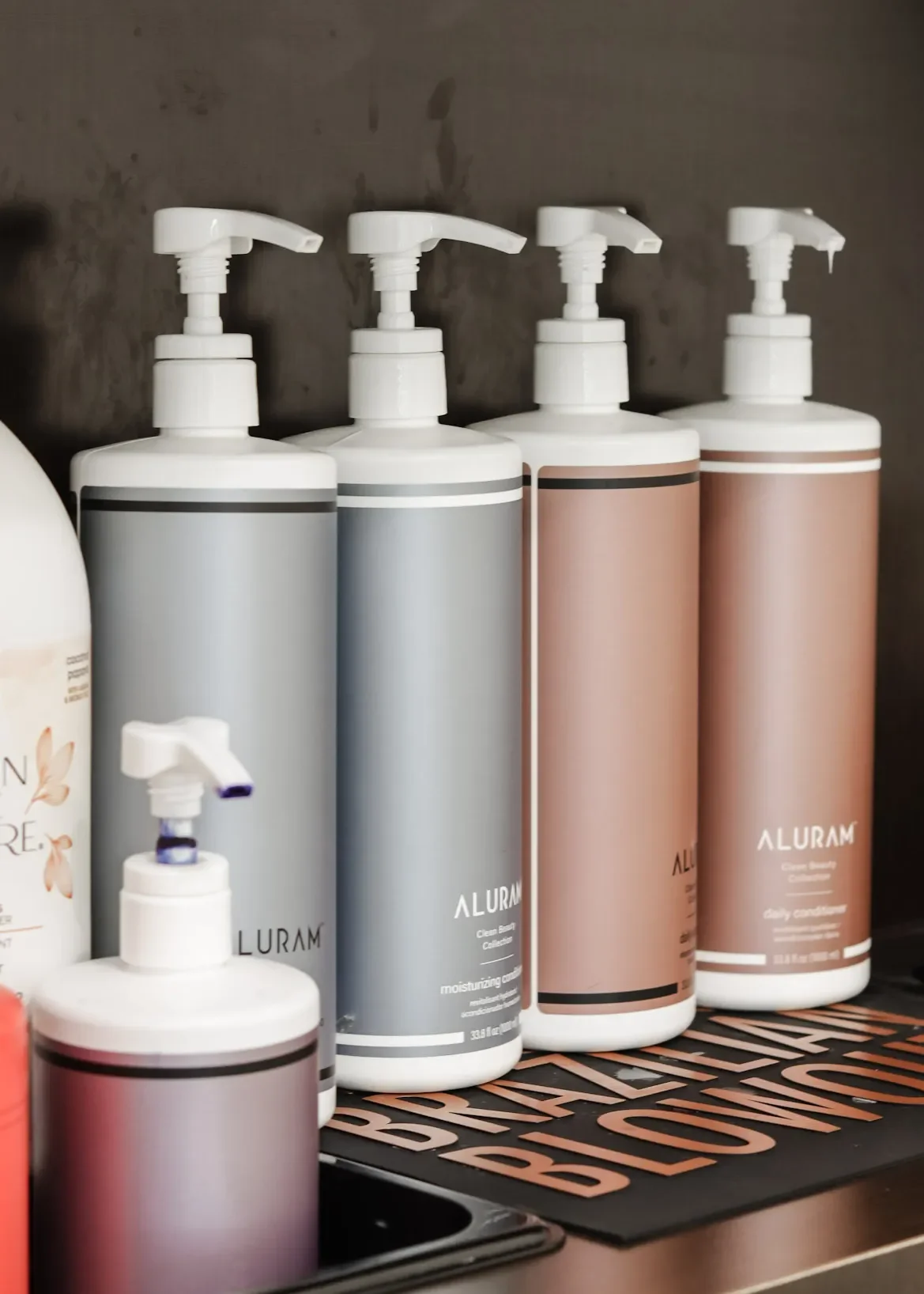 Aluram haircare bottles with pump.