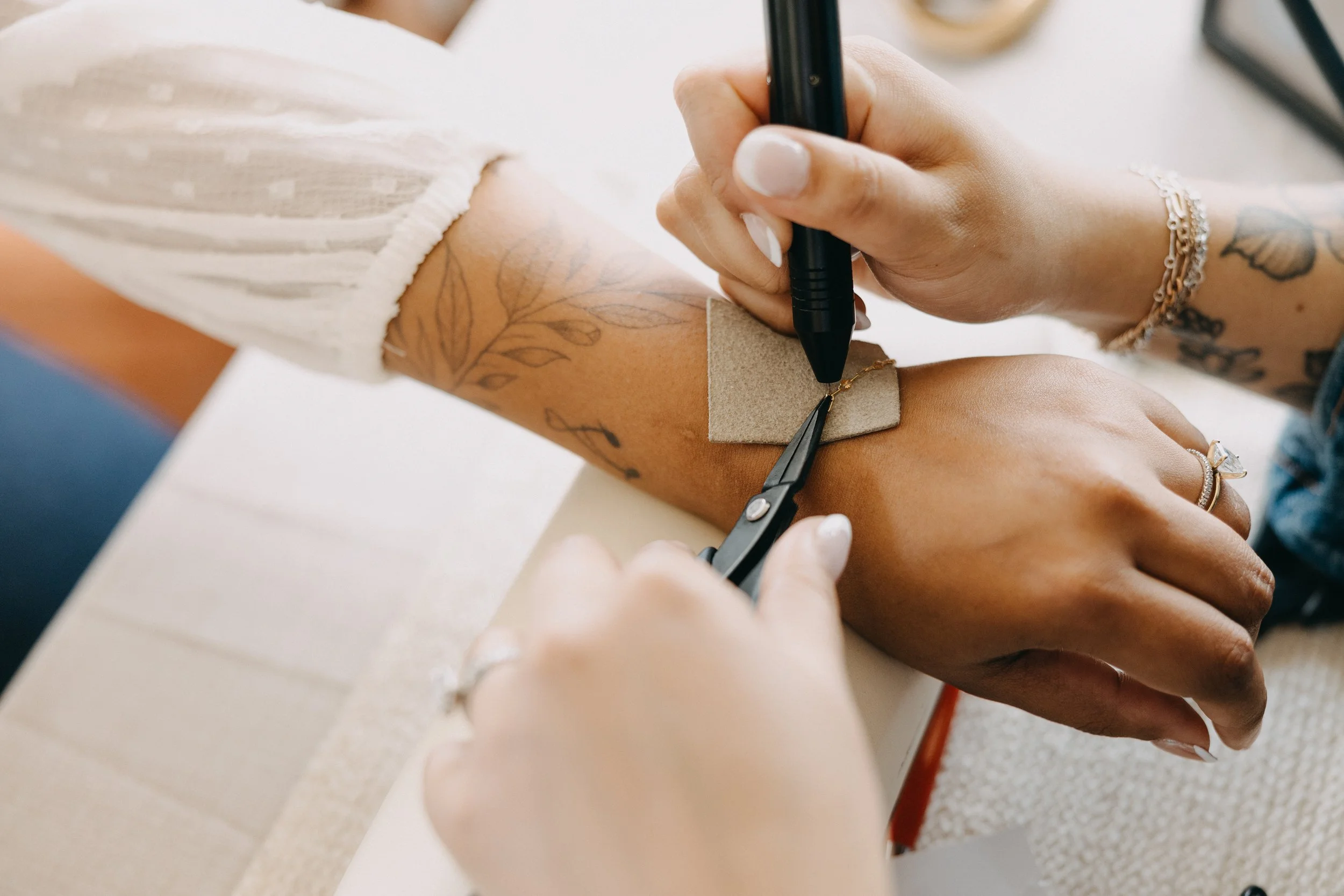 Person holding welding stylus with chain
