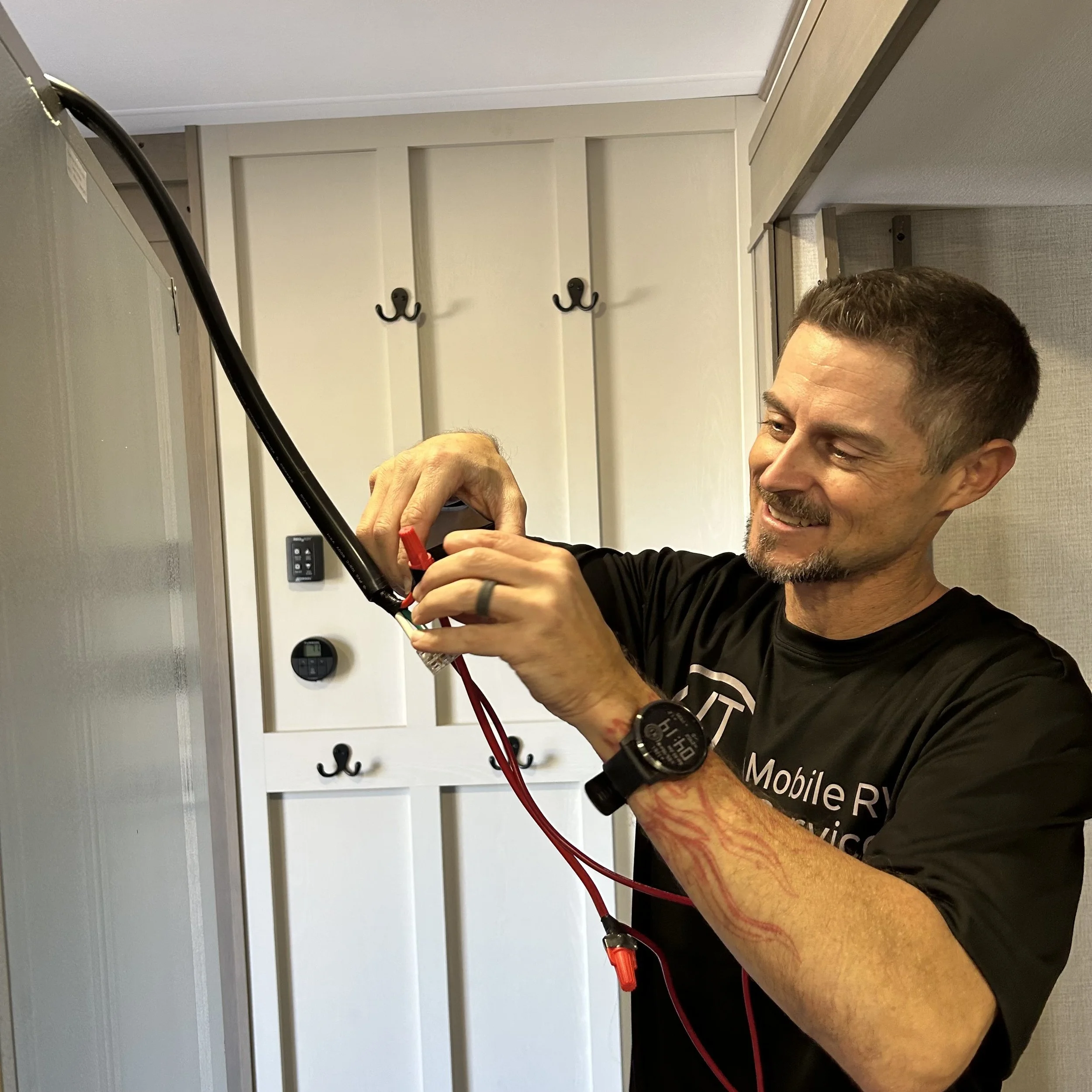 JT/RV Mobile Repair Service repairs a refrigerator