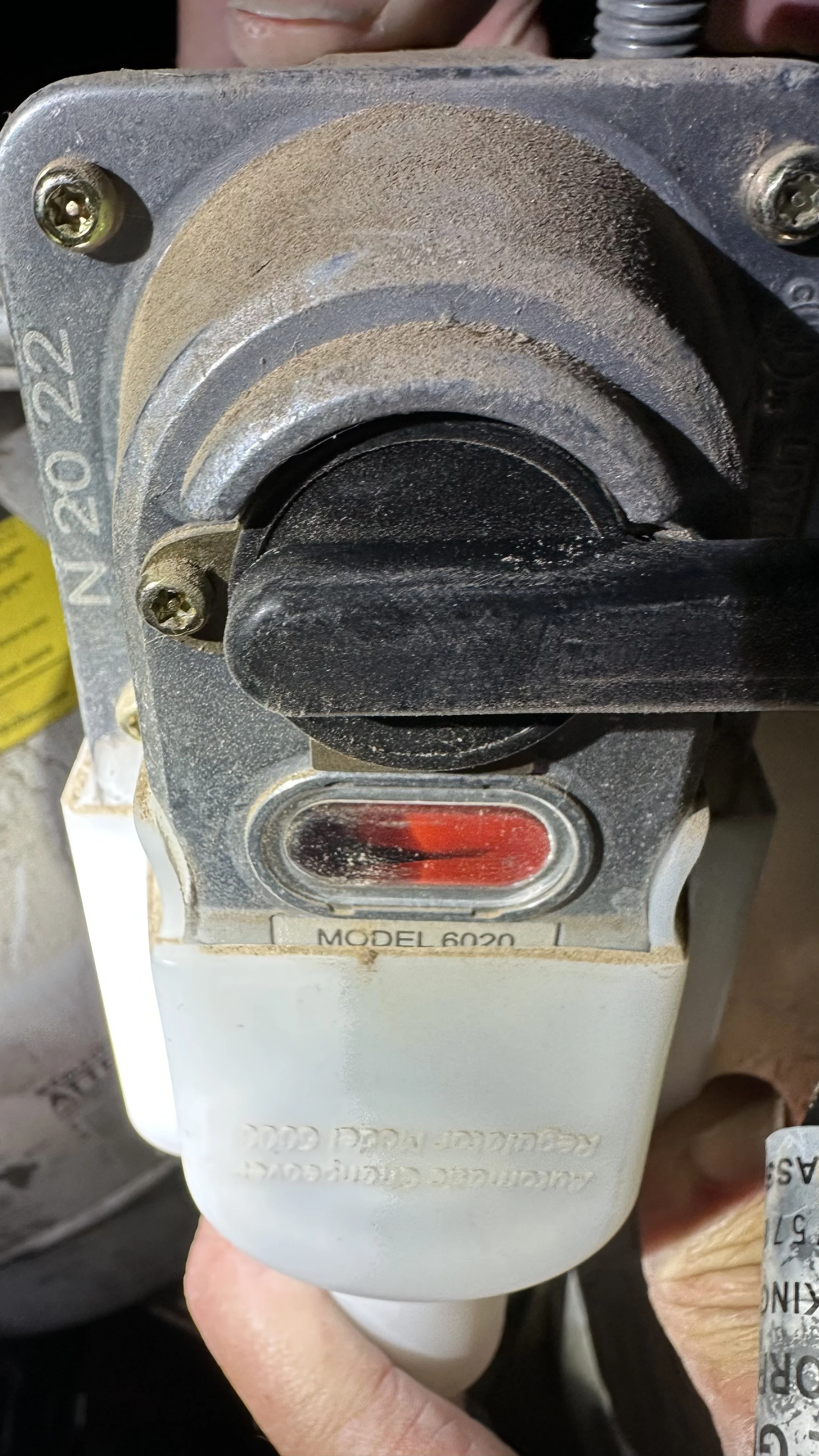 Close-up of a propane regulator recalled by a manufacturer. JT/RV Mobile Repair Service has been approved to perform recall repairs and replacements.