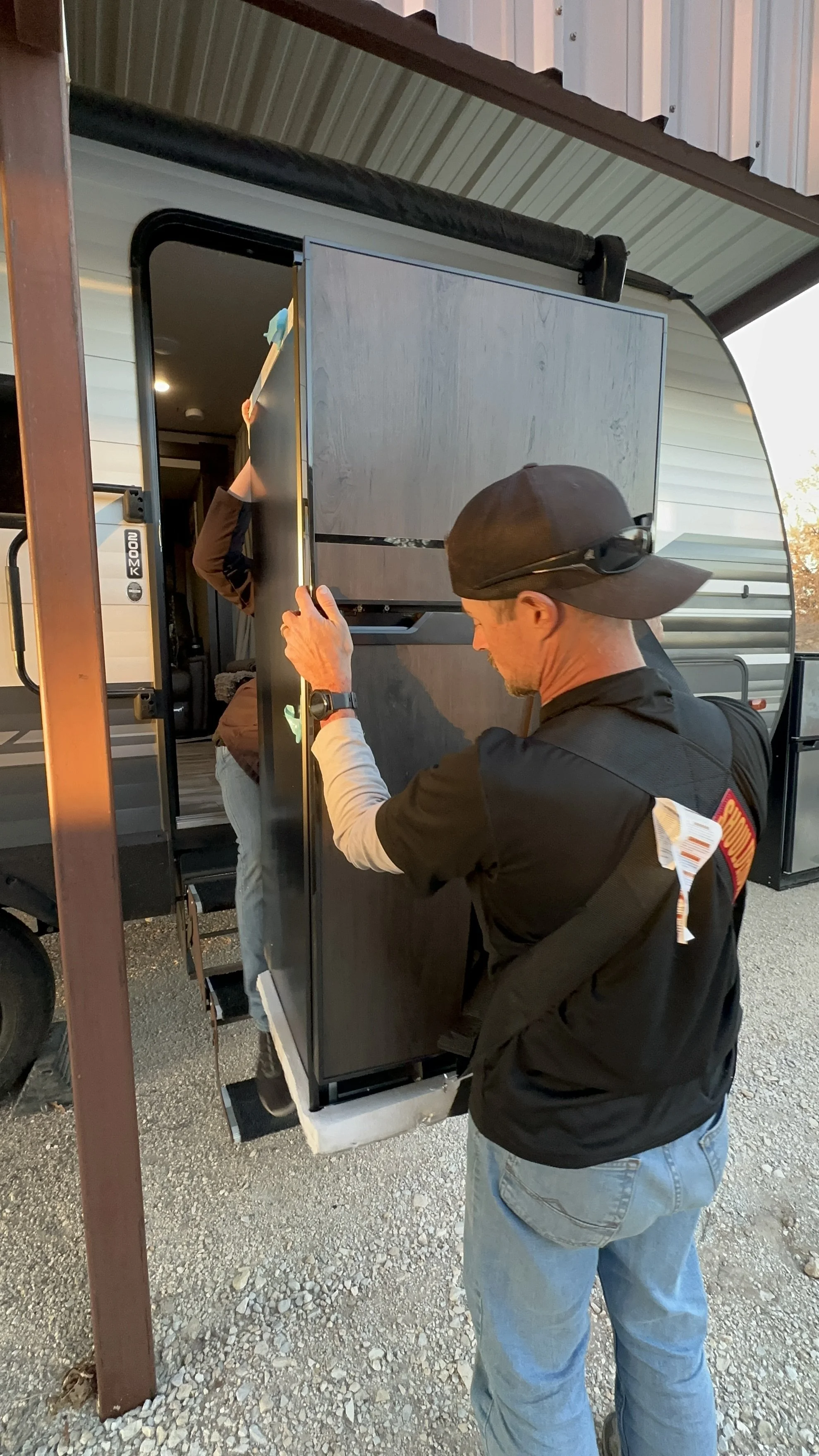 Mobile Repair Tech installs new refrigerator as part of a warranty repair