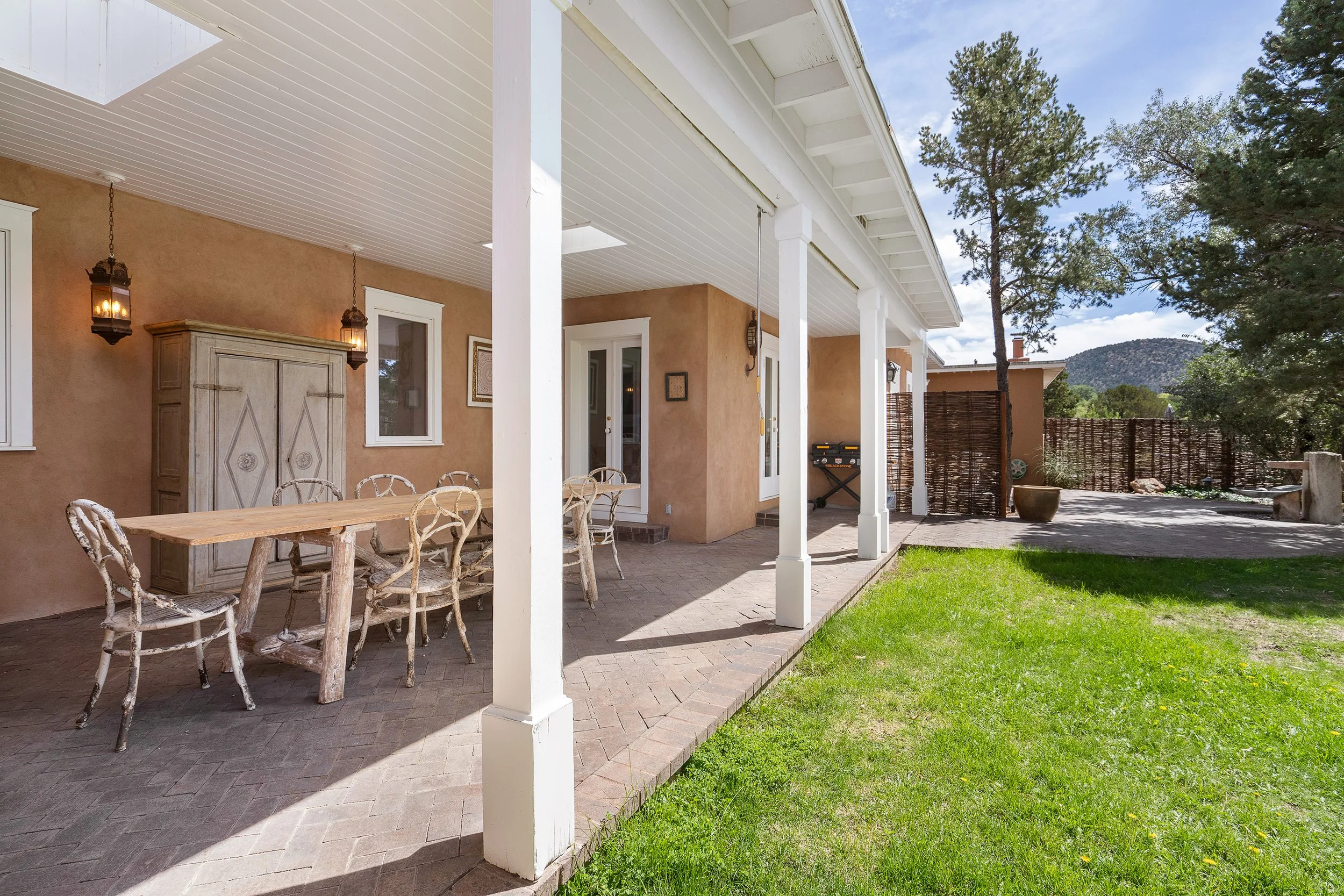 Covered Dining Area With Views of Sun Mountain and Lawn