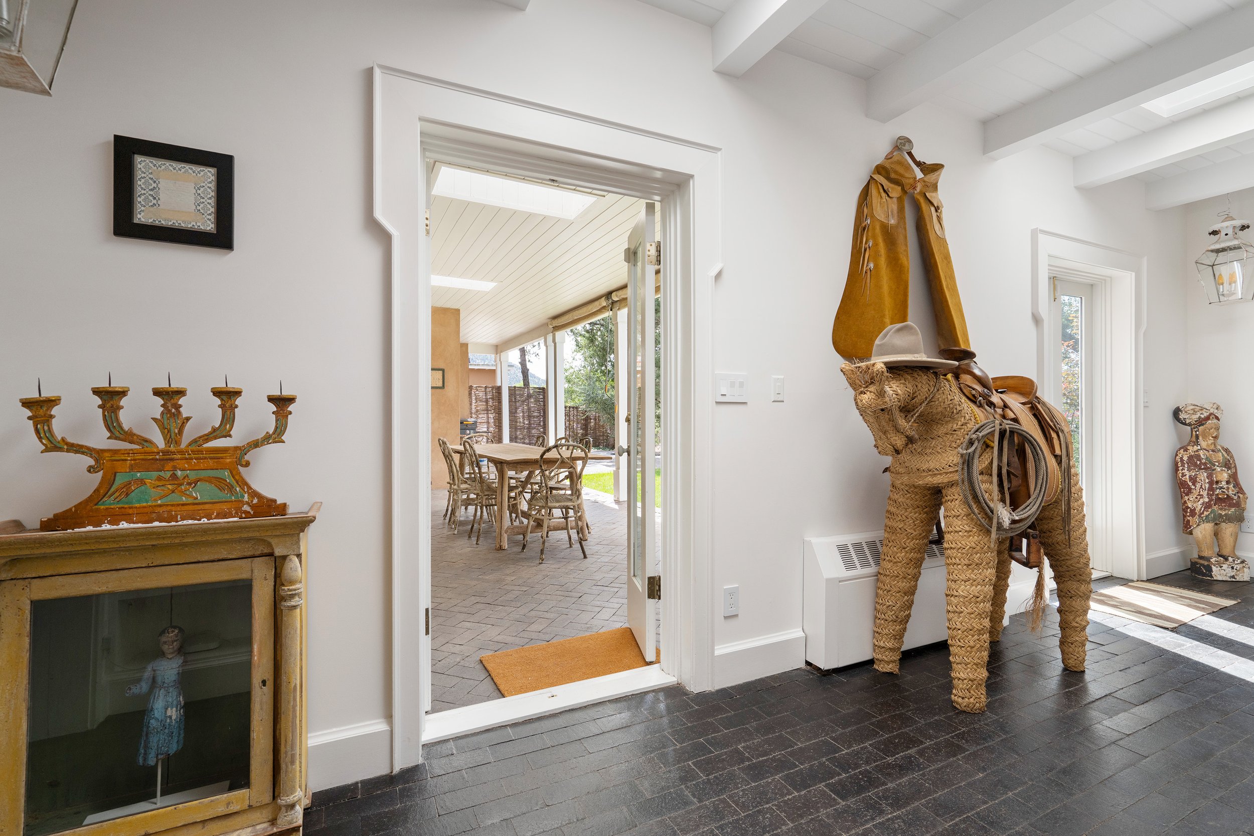 Entrance Hallway Looking Out to Covered Outdoor Dining