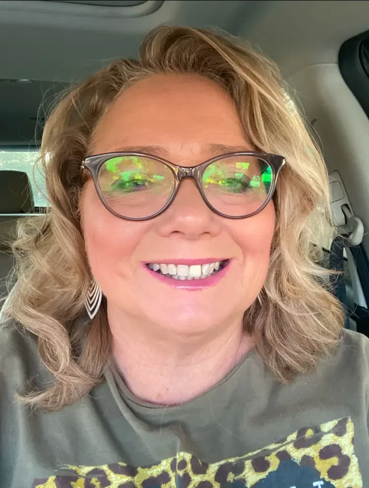 ladyBlondeSmilingGlasses.webp