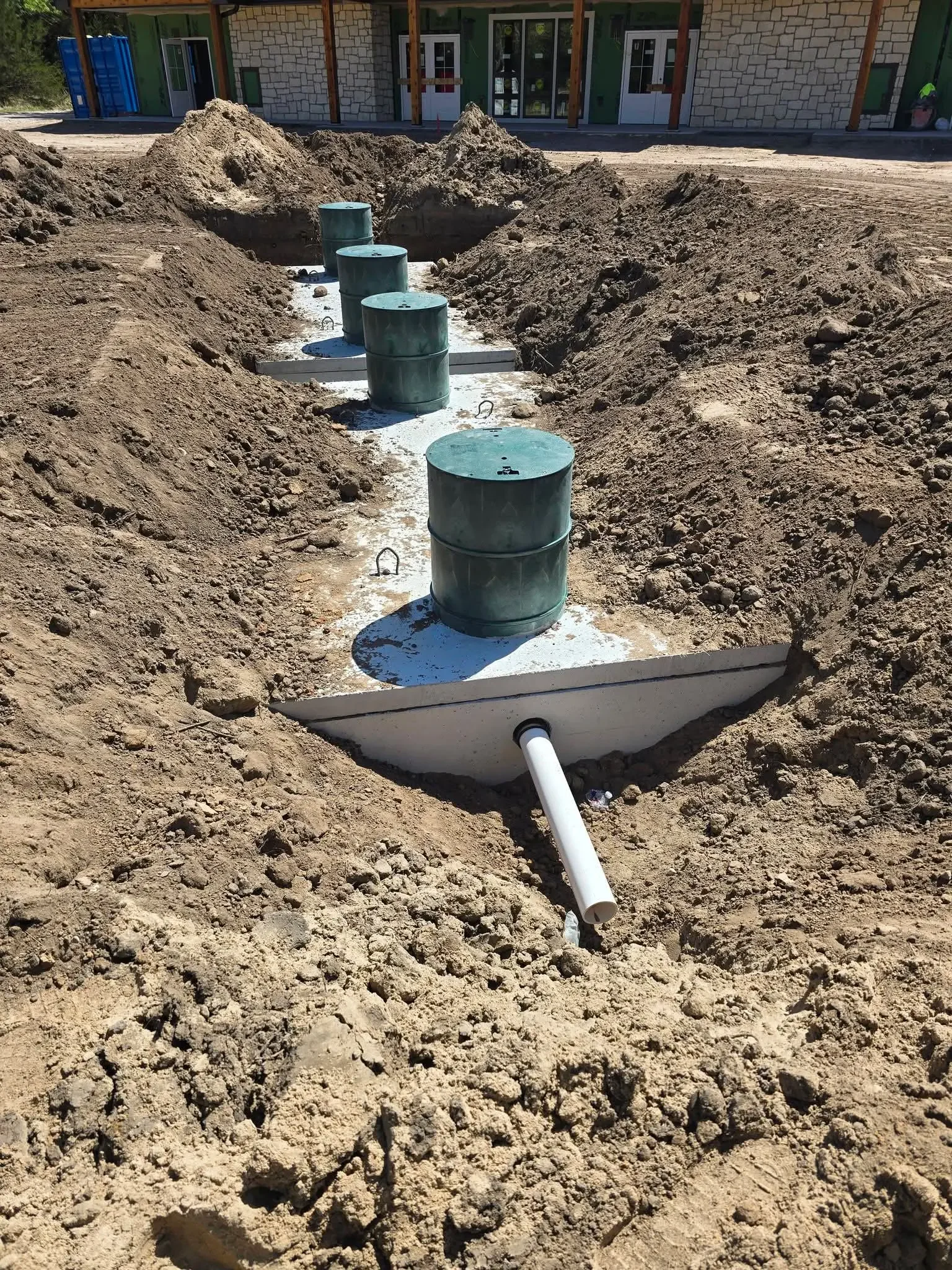 drainageTankWithDirtAndBuckets.webp