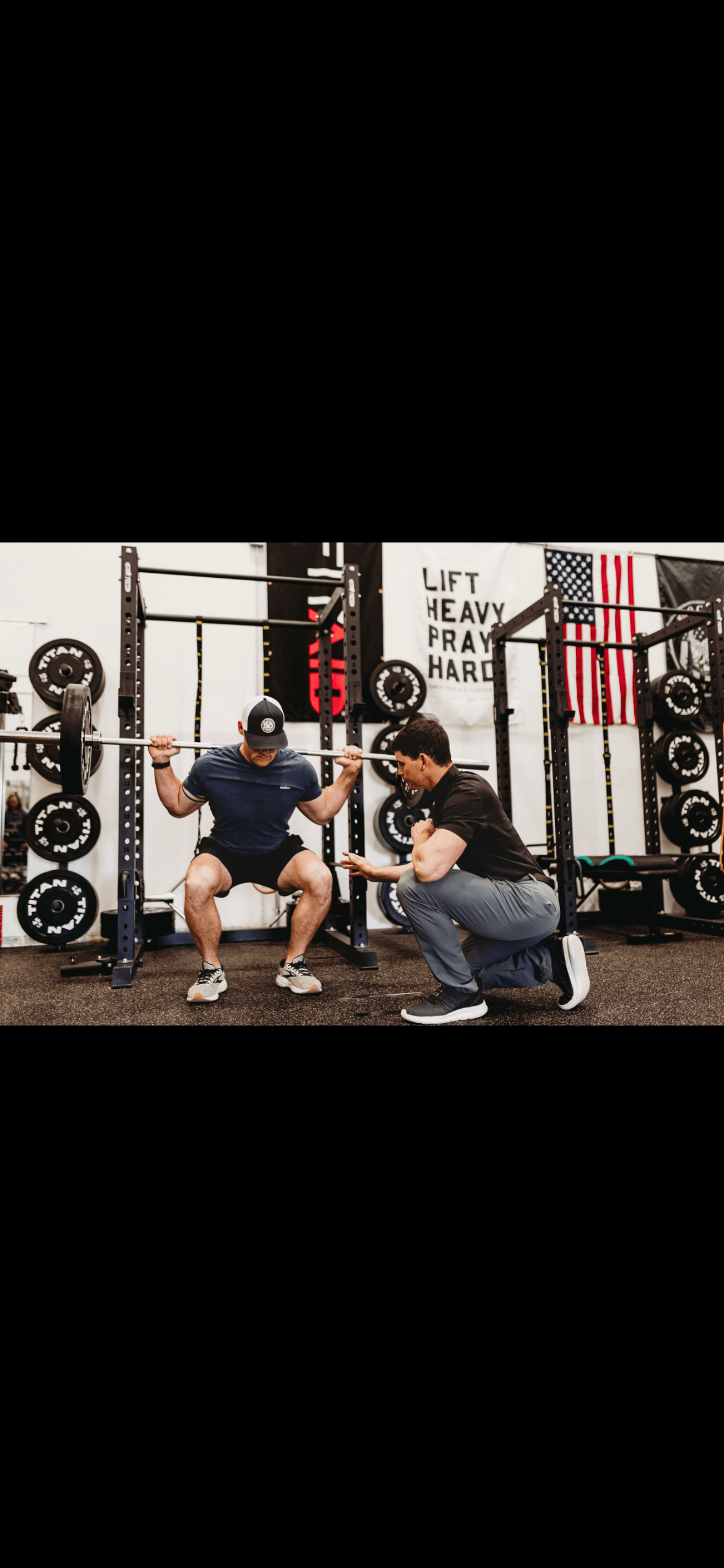 manSquatingOtherCoaching.png