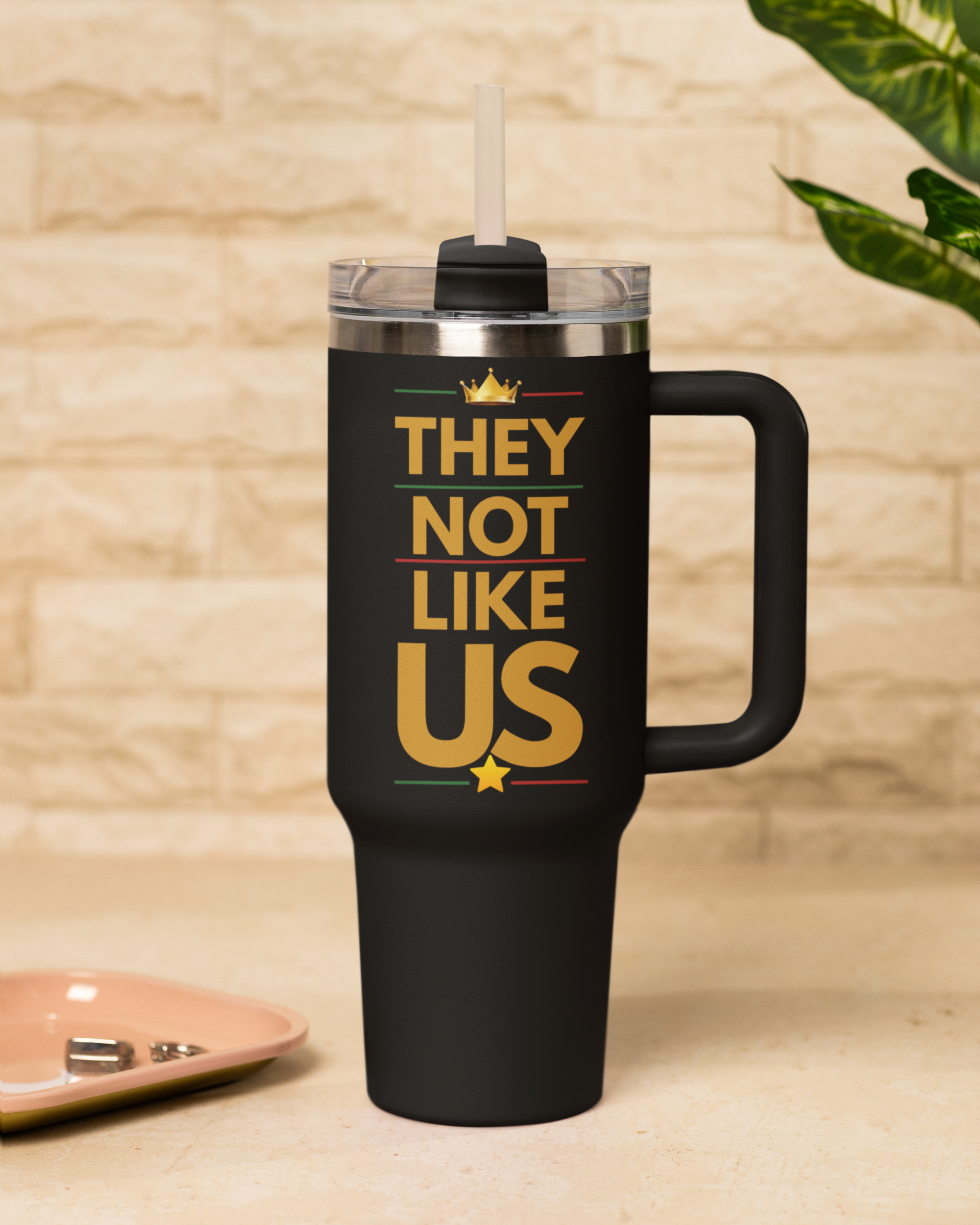 mockup-of-a-sublimated-stanley-tumbler-placed-on-a-table-with-a-plant-m54042+%281%29.png