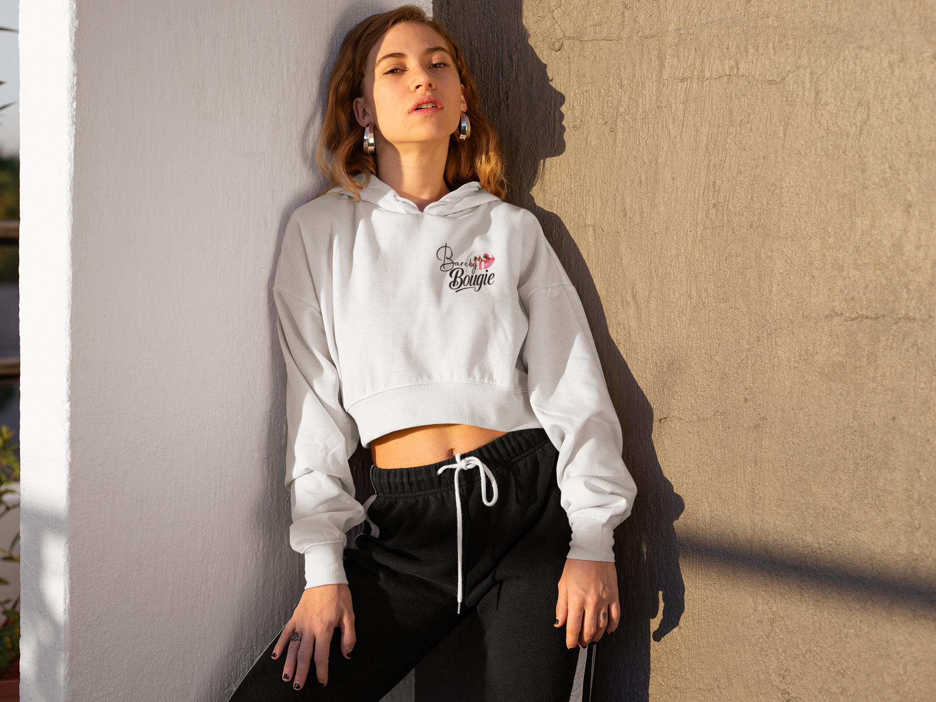crop-top-hoodie-mockup-of-a-blonde-girl-posing-in-the-corner-of-a-wall-26042 (1).png
